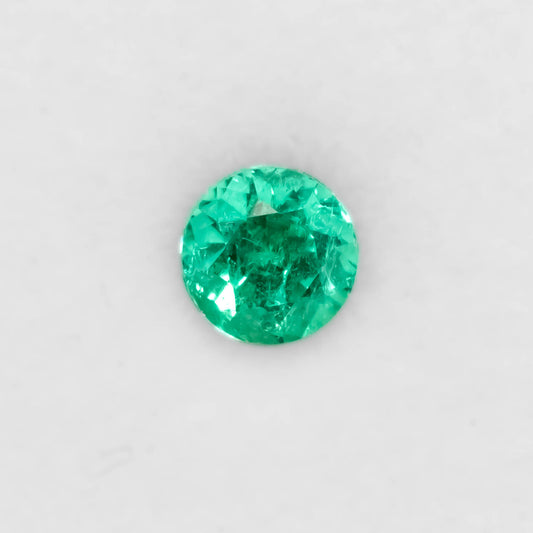 Front view of 1.26CT Natural Colombian Emerald – Emerald Cut Vivid Green Gemstone in white background.