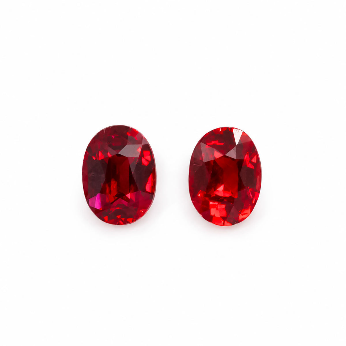 0.83ct matching pair of natural unheated rubies, vivid red oval cut