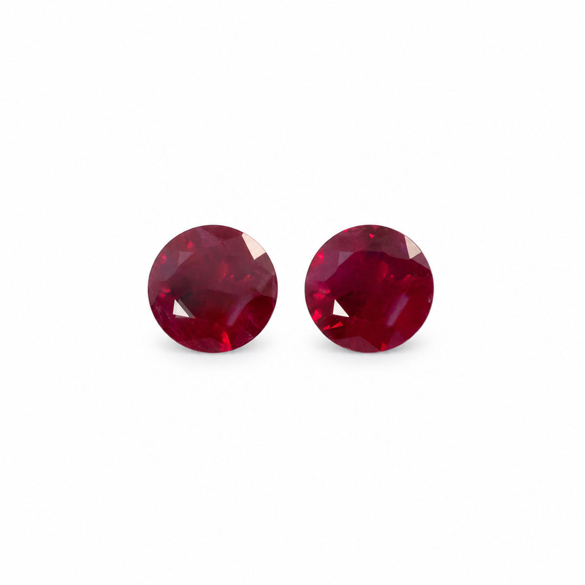 0.80ct matching pair of natural rubies, vivid red round cut