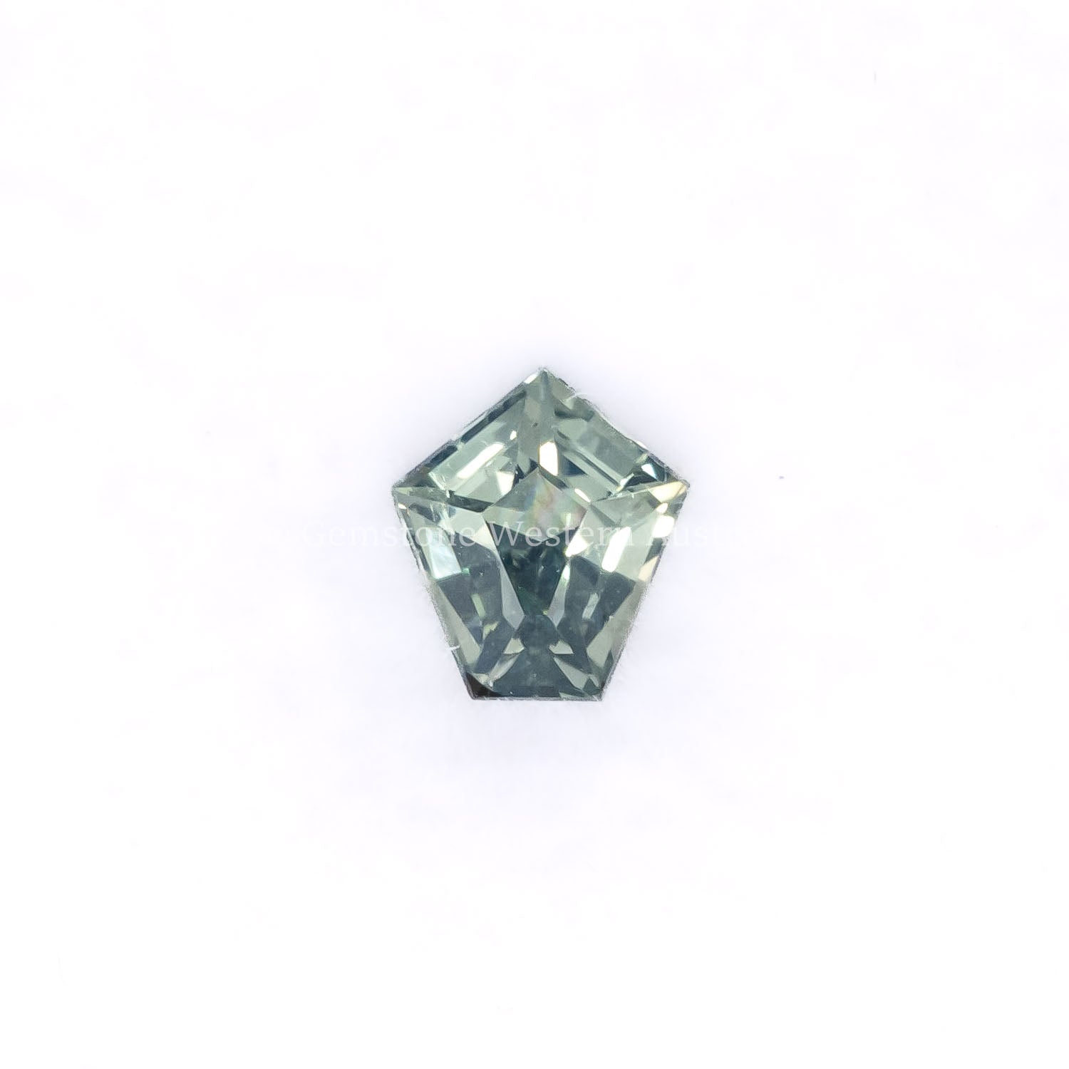 Front view of 0.61CT Natural Unheated Teal-Green Sapphire – Shield Fancy Cut in white background.