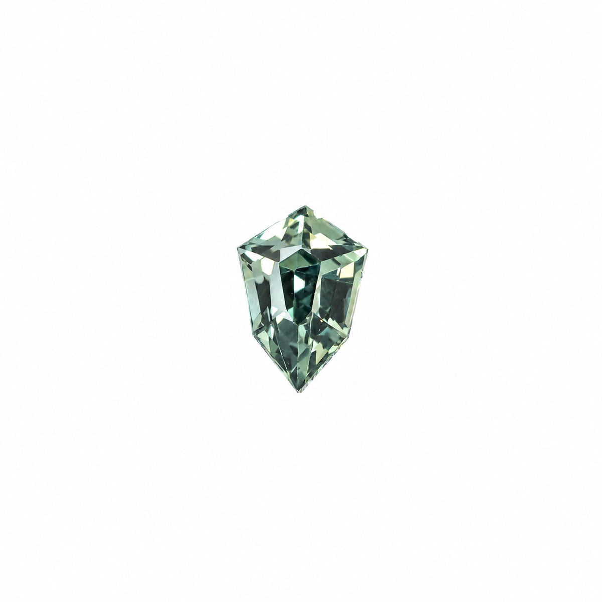0.45 ct natural unheated teal-green sapphire, shield fancy cut