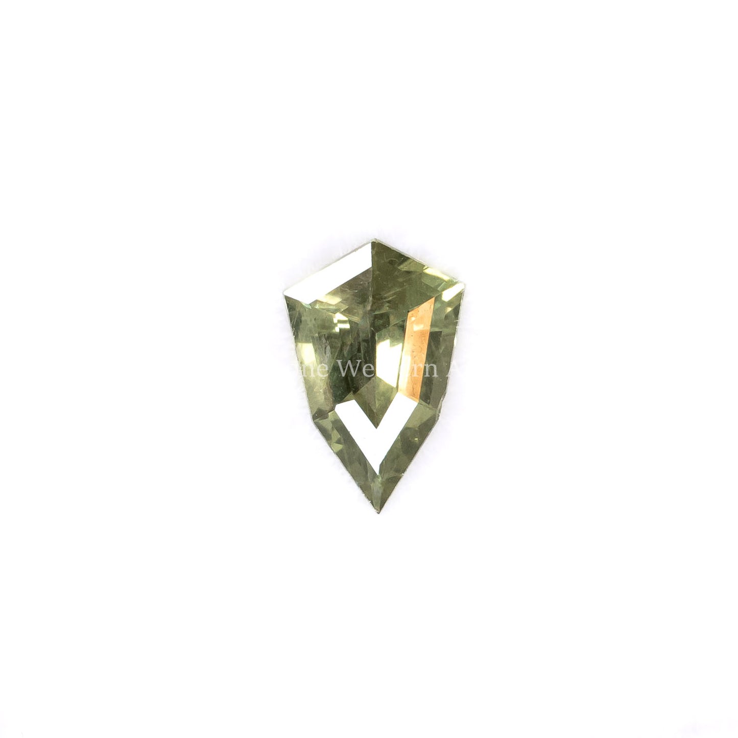 Front view of 0.67CT Natural Unheated Teal-Green Sapphire – Shield Fancy Cut in white background.