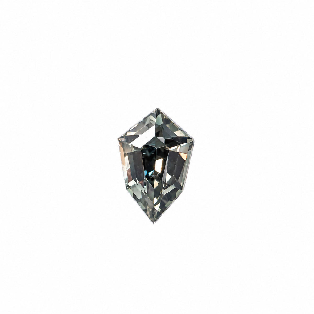0.62 ct natural unheated teal-green sapphire, shield fancy cut