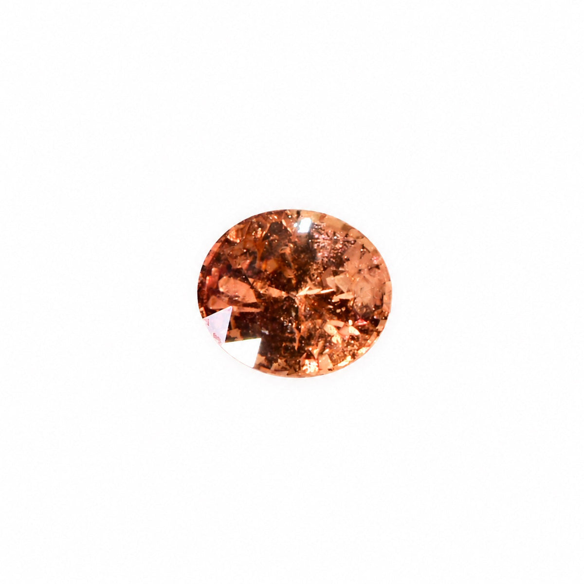 1.58 ct padparadscha sapphire oval cut shown at an angle