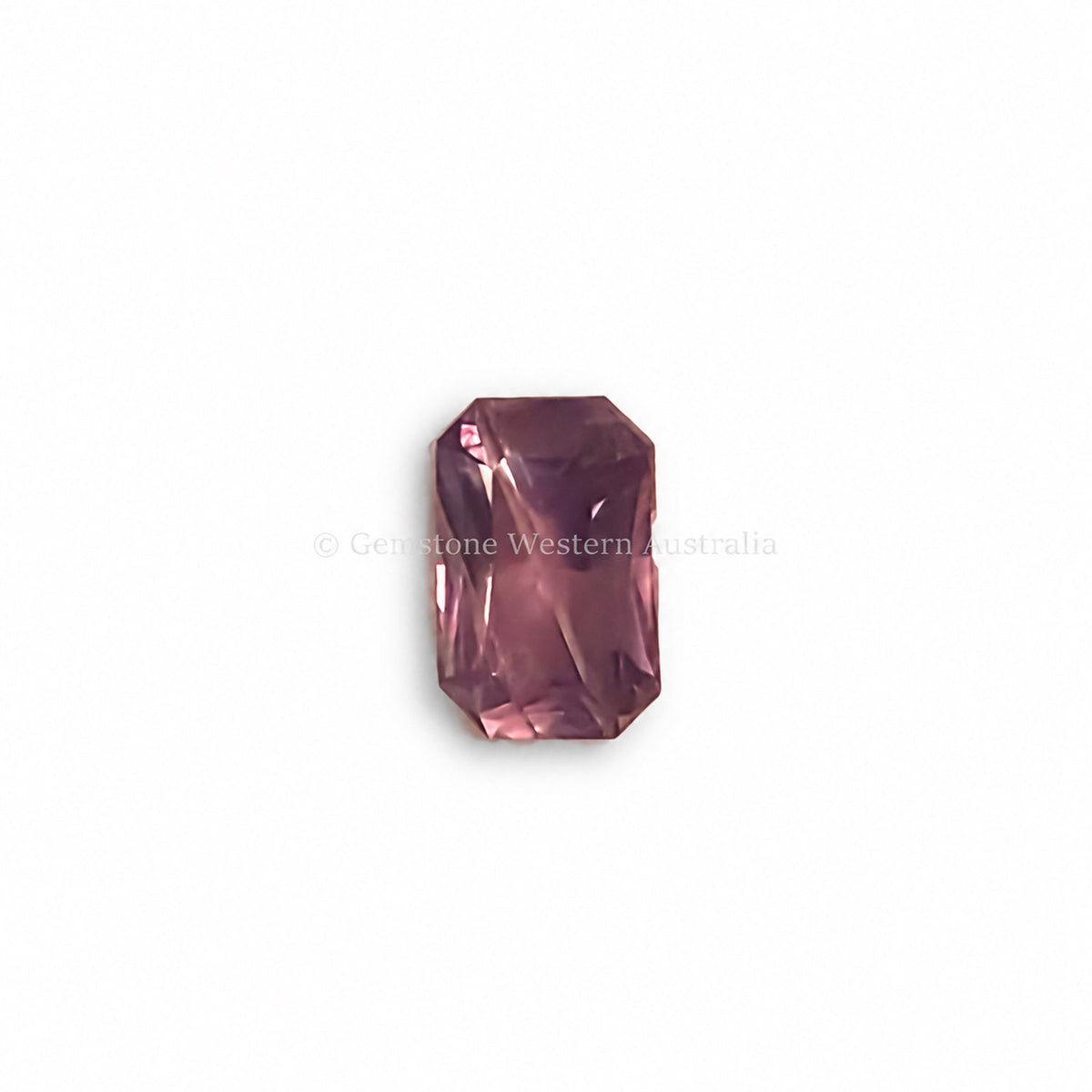 1.46 ct alexandrite under warm candlelight showing its colour change