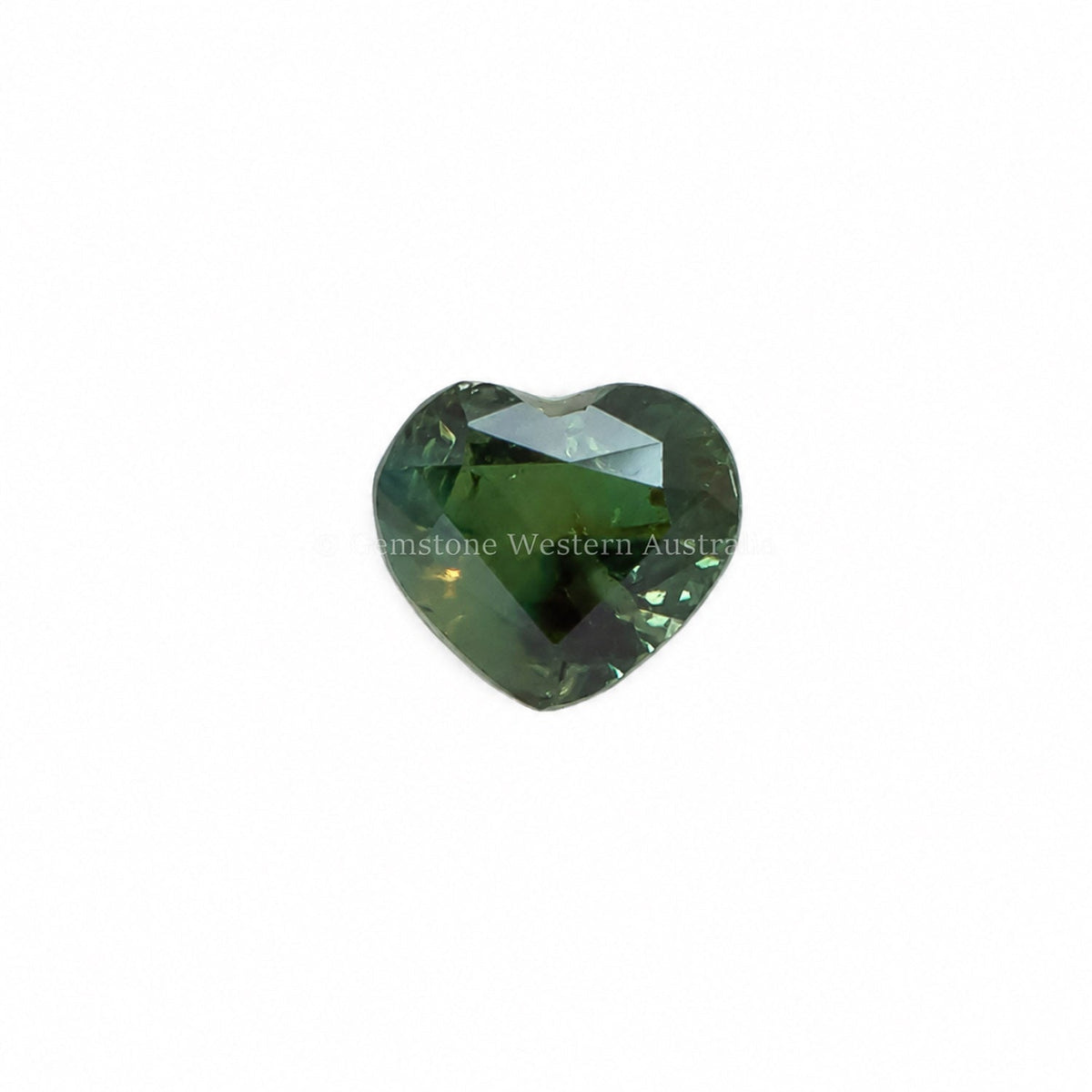 0.58 ct heart cut alexandrite photographed in daylight