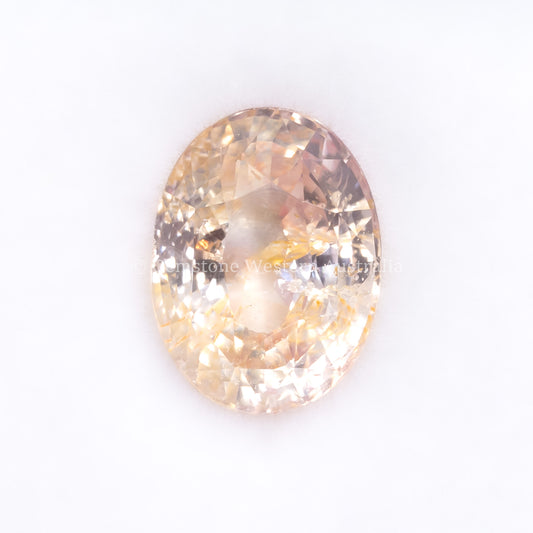 Front view of 4.06CT NATURAL PEACH SAPPHIRE – OVAL MIXED CUT (UNHEATED) in white background.
