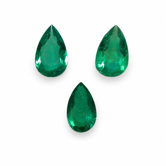 front view of Natural Colombian Emerald Set – Three Matched Pear Shape Emeralds in white background