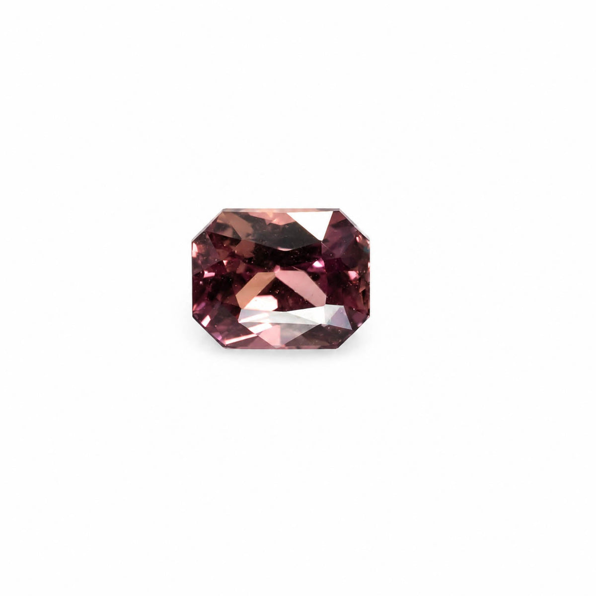 1.58 ct unheated brown sapphire shown in a second lighting view
