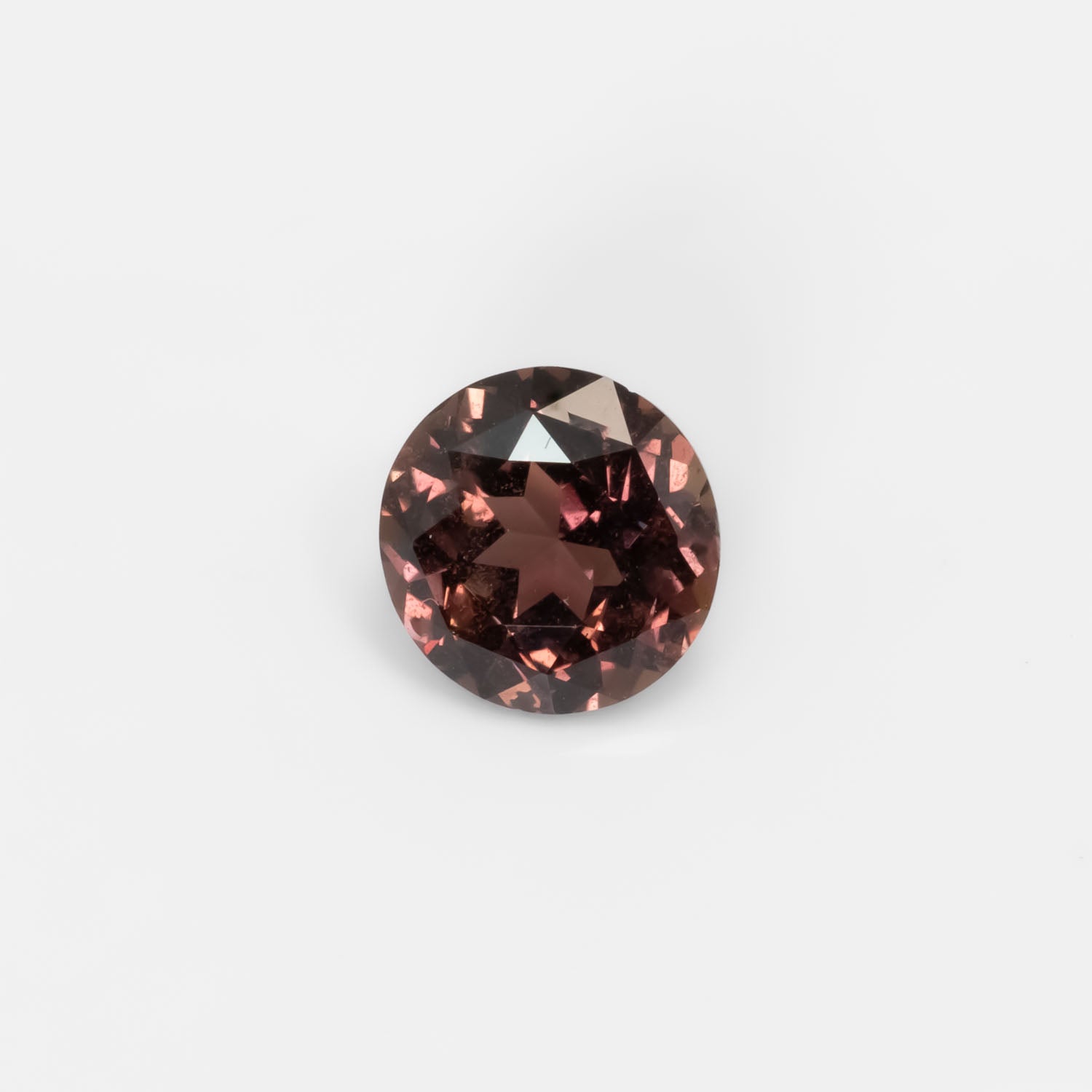 Front view of 1.89CT Natural Unheated Colour Change Brown-Red Sapphire – Round Mixed Cut in white background.