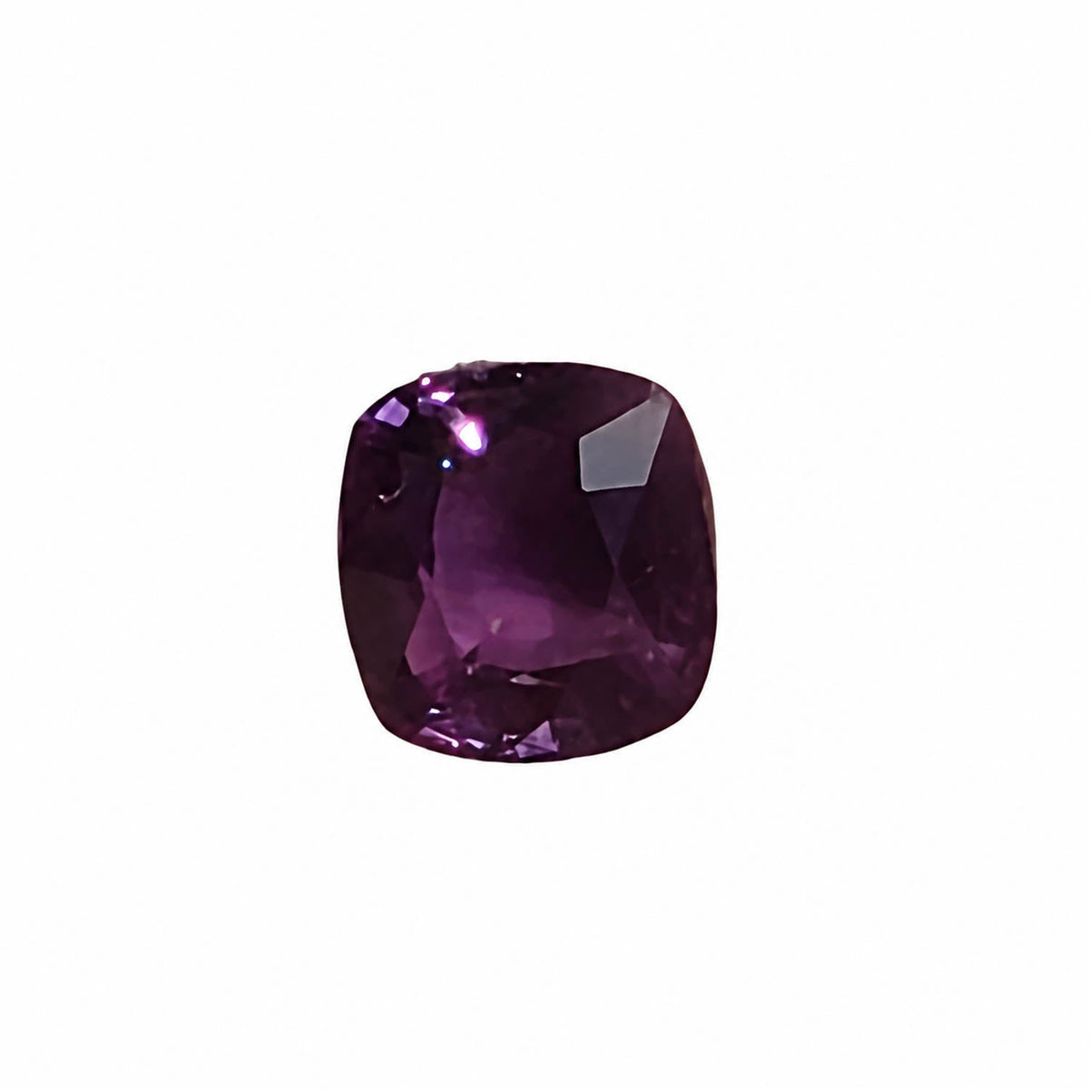 1.60 ct alexandrite under warm light showing its colour change