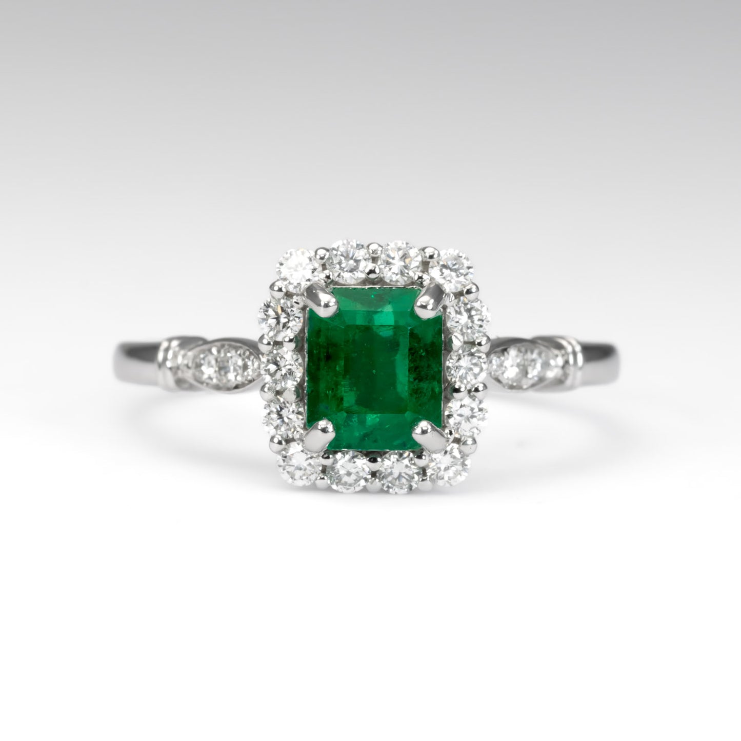 front view of TCW 1.05 Emerald Cut Emerald Ring in Platinum in white background