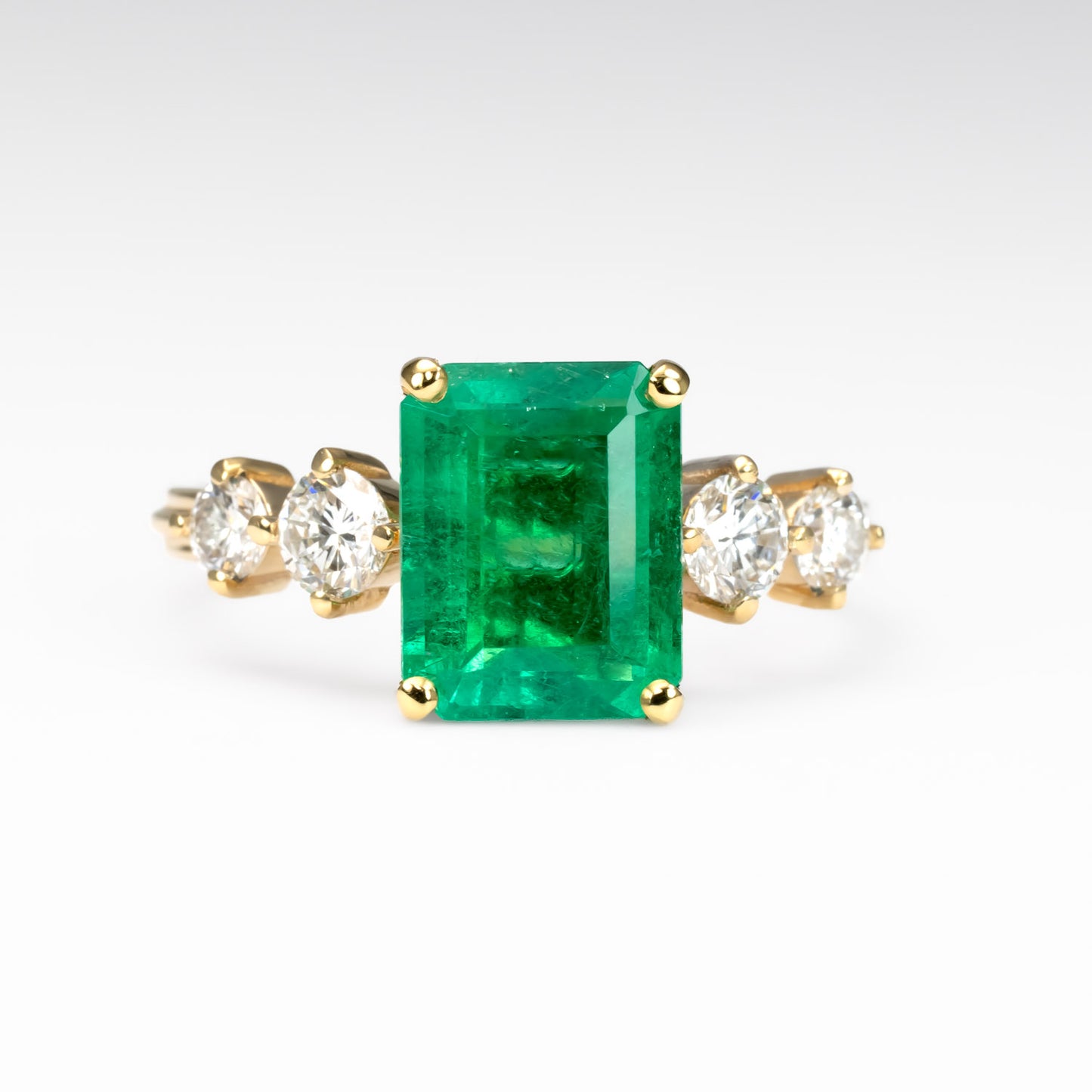 front view of 2.29ct Natural Colombian Emerald Ring with GIA Diamonds in white background 
