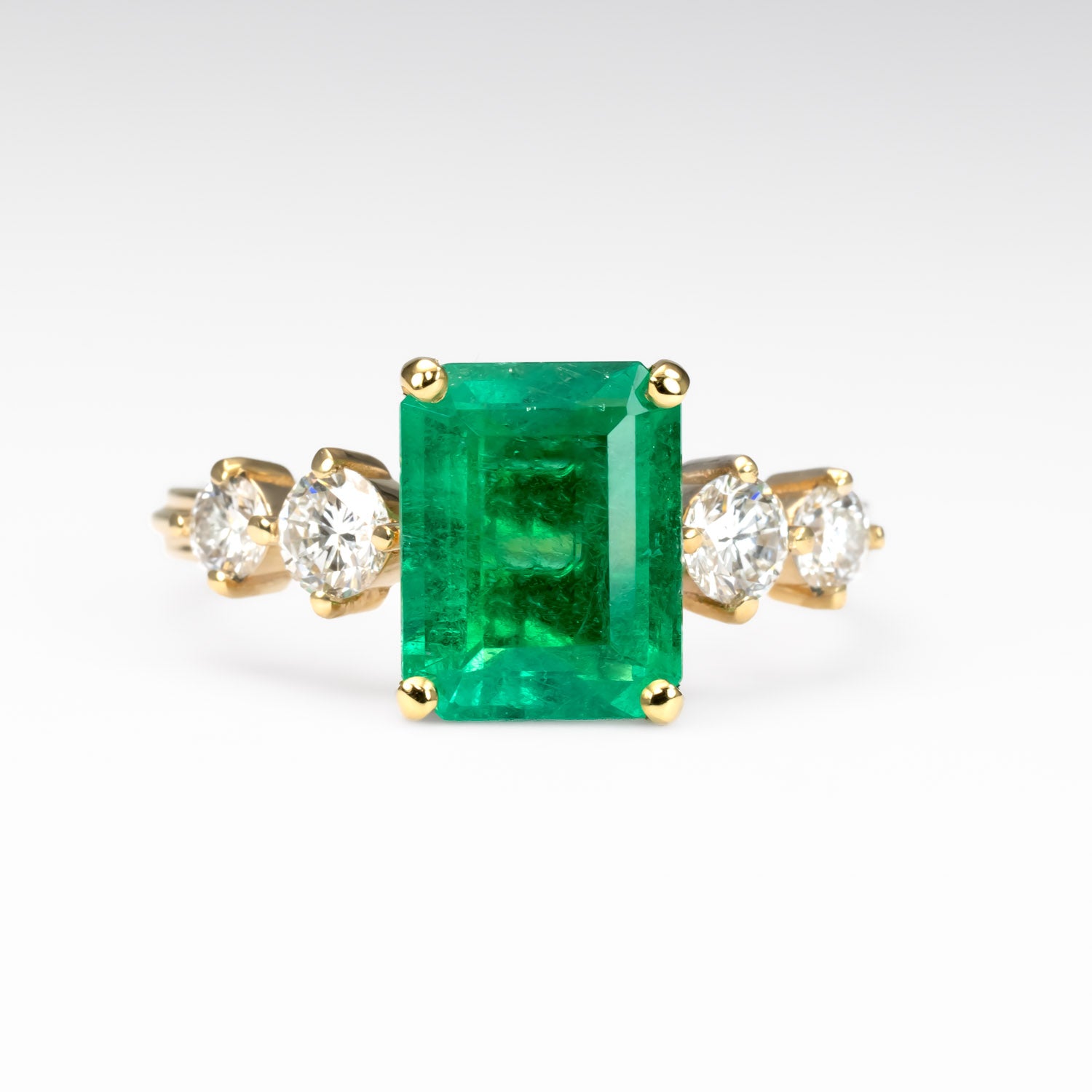 front view of 2.29ct Natural Colombian Emerald Ring with GIA Diamonds in white background 