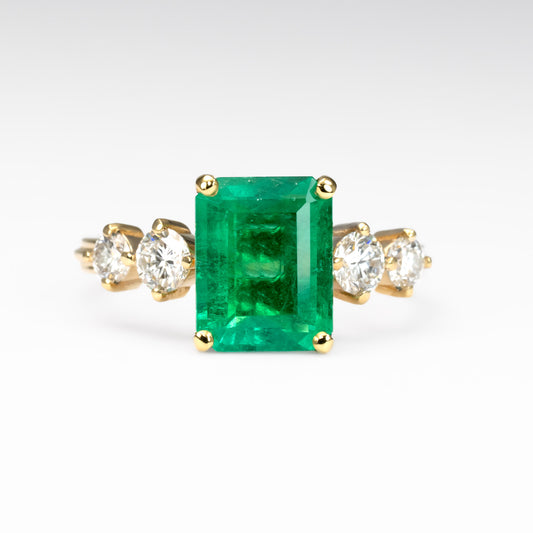 front view of 2.29ct Natural Colombian Emerald Ring with GIA Diamonds in white background 