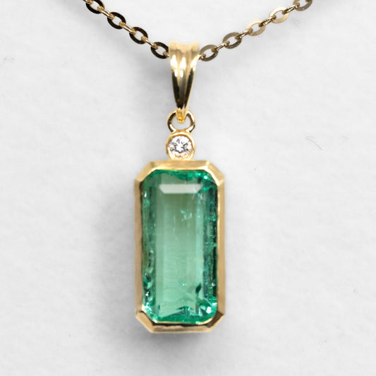 front view of 2.70ct Emerald cut Pendant in white background 