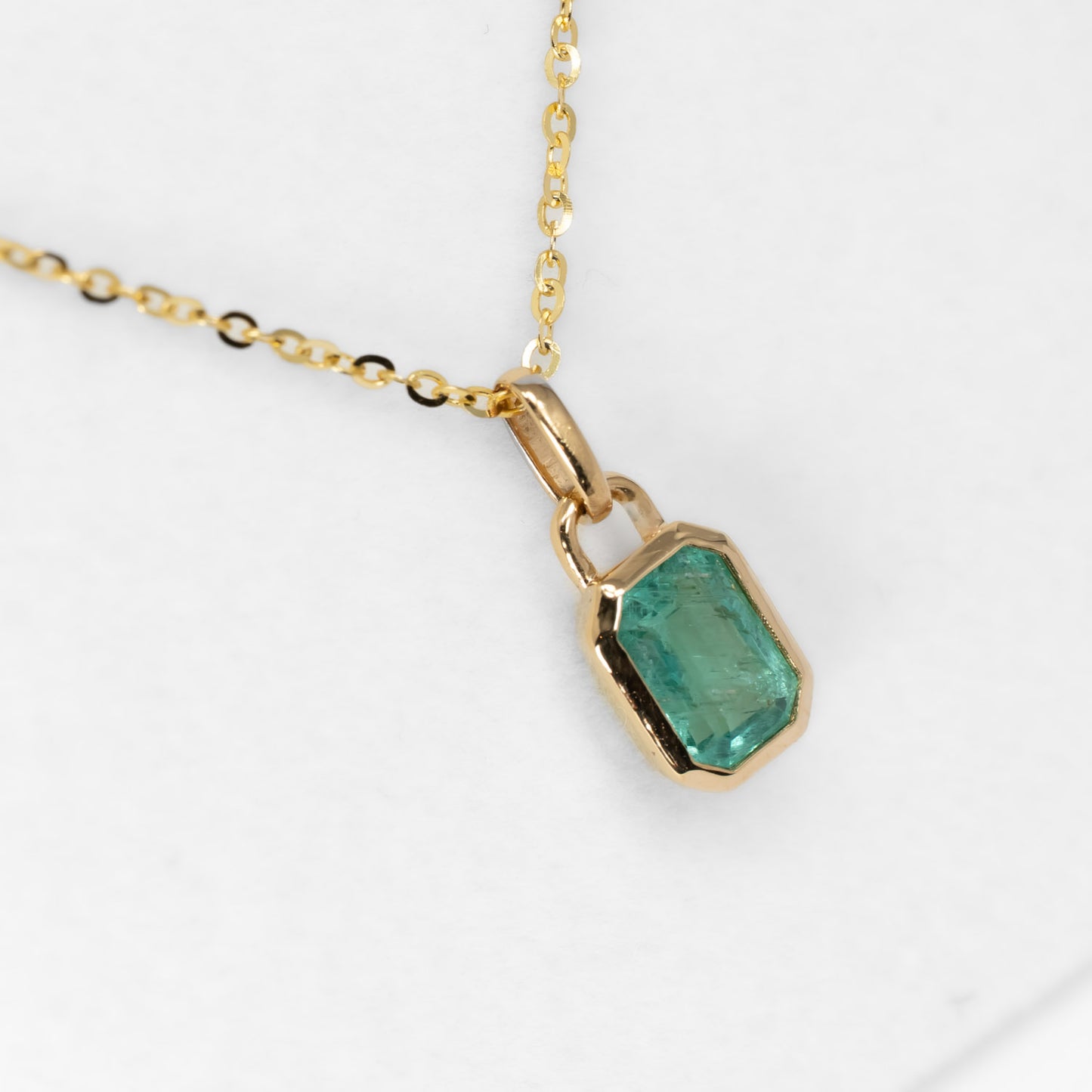 side view of 0.91ct Natural Elongated Emerald Cut Emerald Pendant