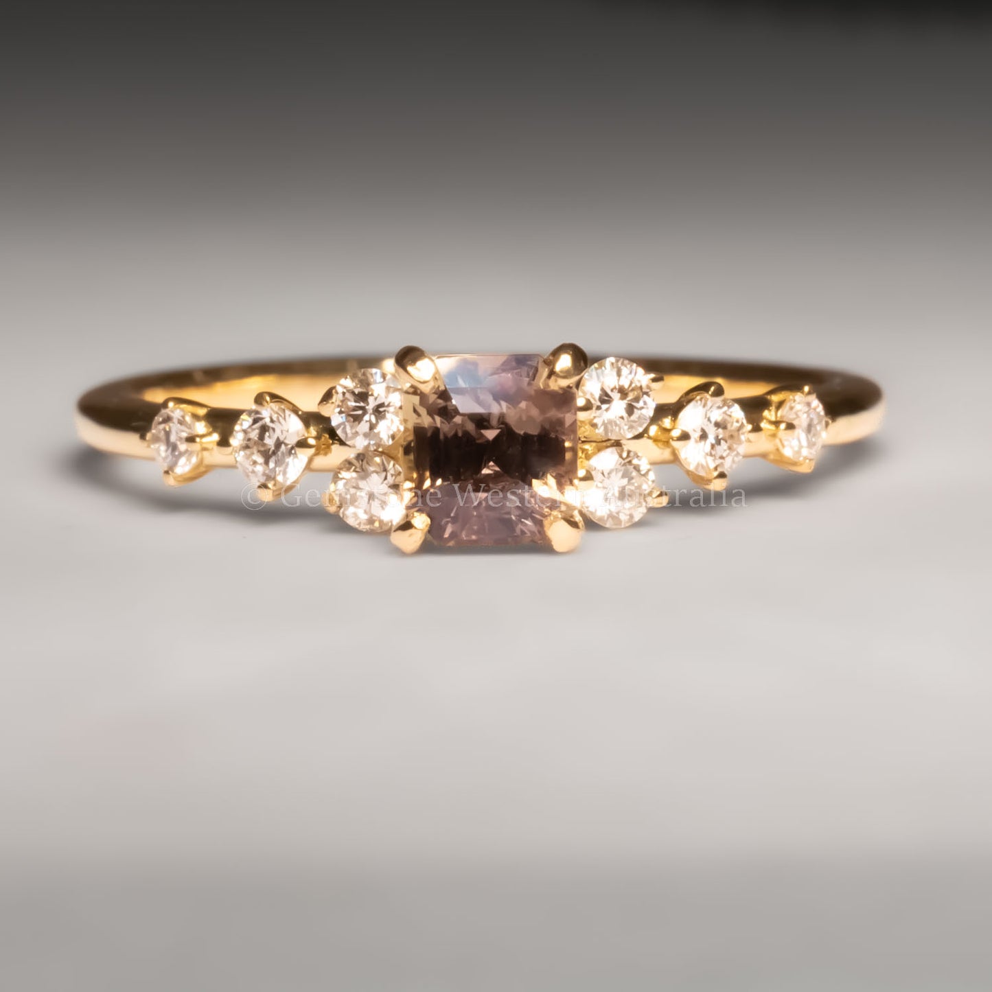 front view of Natural Octagon Cut Alexandrite Ring 0.53ct with Diamond Accents under incandescent light