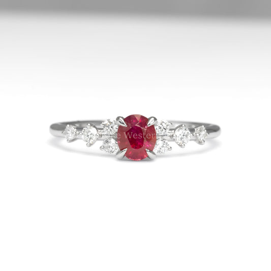 front view of natural ruby and diamond ring in platinum 950 in white background
