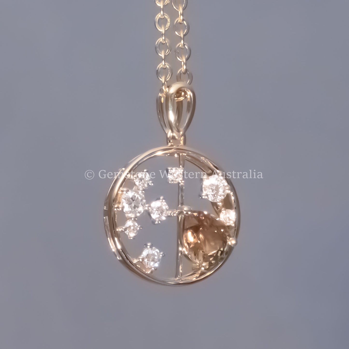 front view  under incandescent light of Natural Alexandrite and Diamond Pendant in 18K Yellow Gold – 0.63ct Pear Cut in neutral background