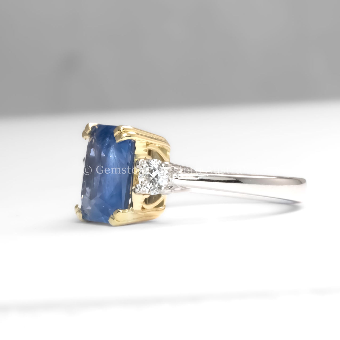 side view of Unheated Blue Sapphire and Diamond Ring in Platinum and 18K Gold – 4.60ct Centre Stone in neutral background 