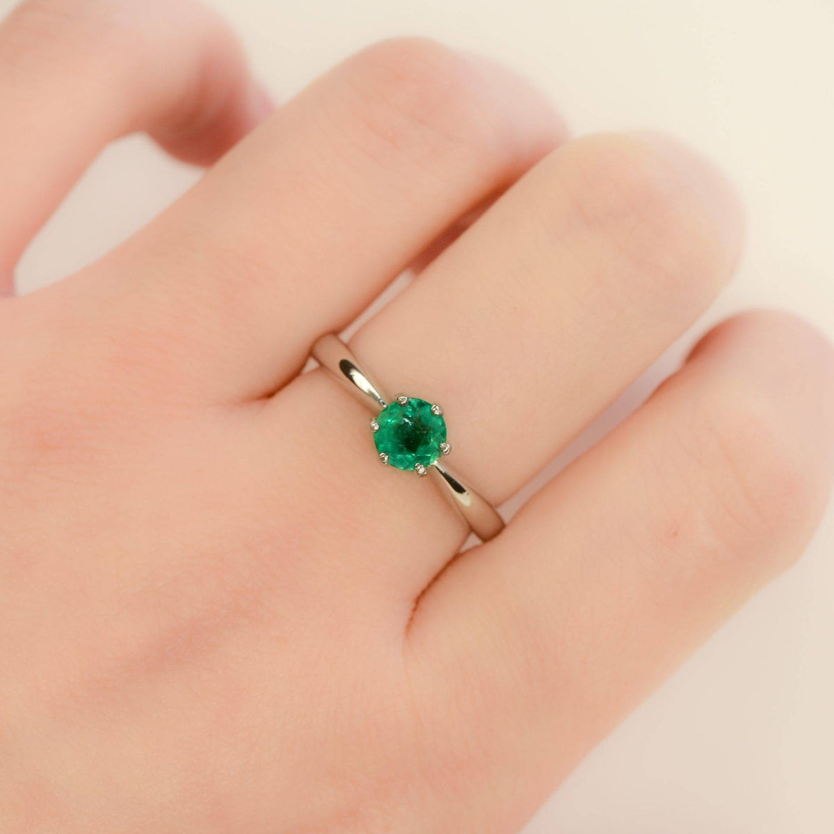 Solitaire Colombian Emerald Ring in Platinum