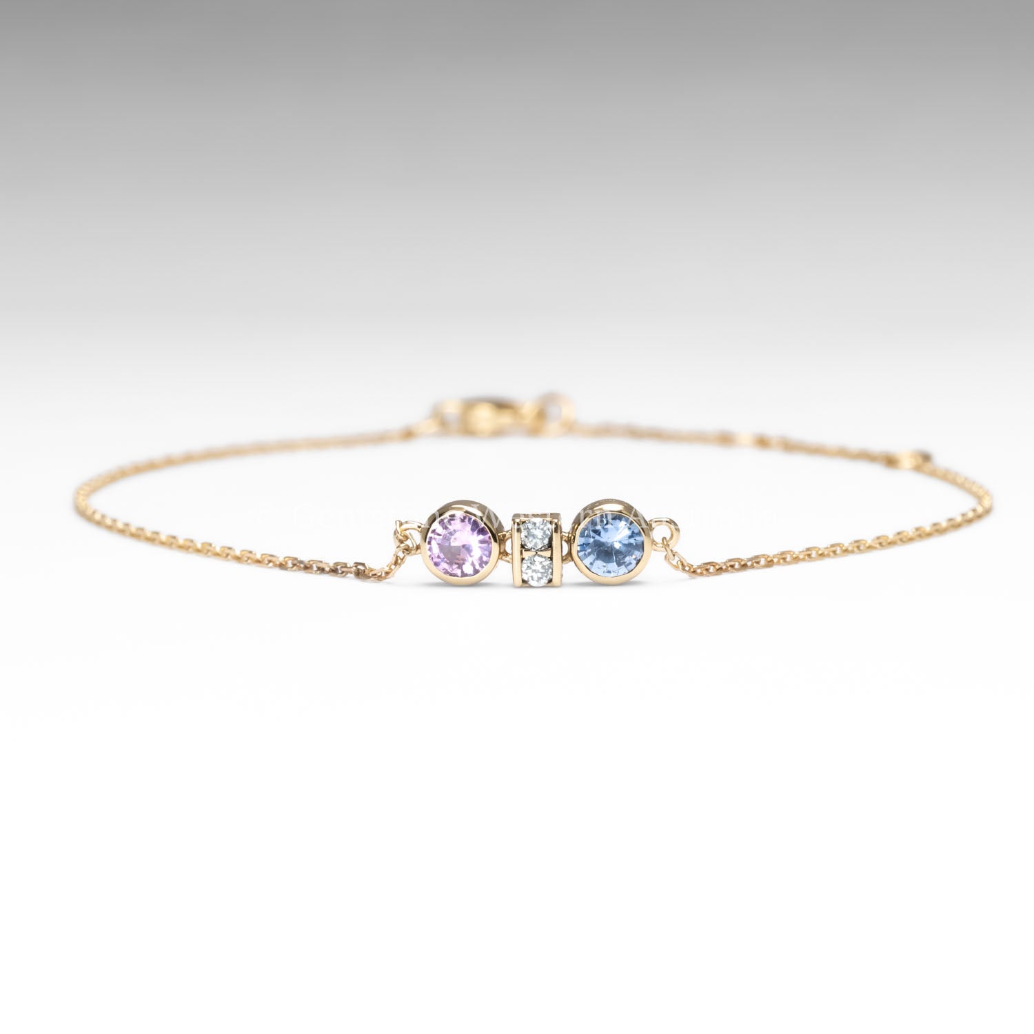 front view of Pink and Blue Sapphire Diamond Bracelet in 18K Yellow Gold in white background