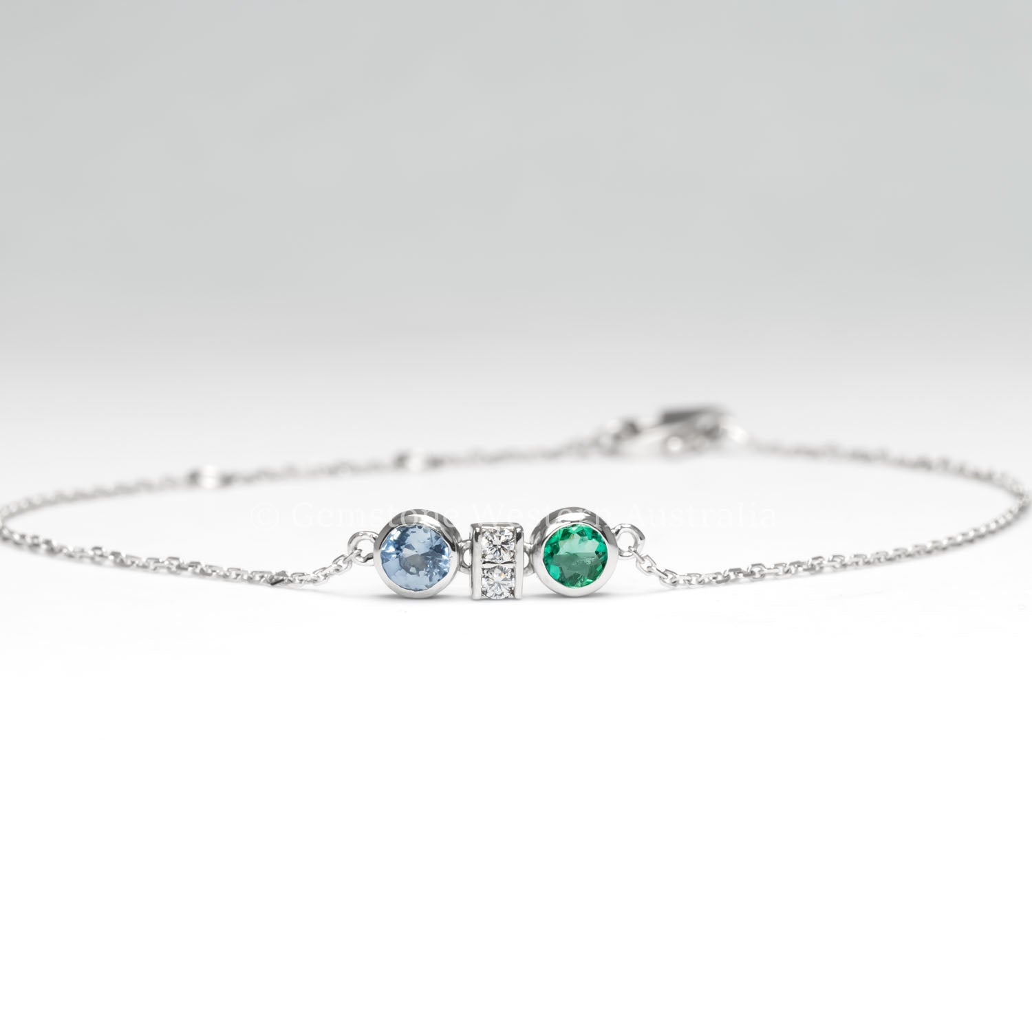 front view of Colombian Emerald, Diamond and Blue Sapphire Bracelet in Platinum 950 in white background