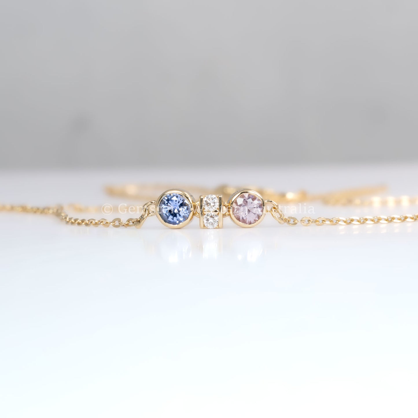 front view of Pink Sapphire & Purple Blue Sapphire Diamond Pendant in 18K Yellow Gold in neutral background