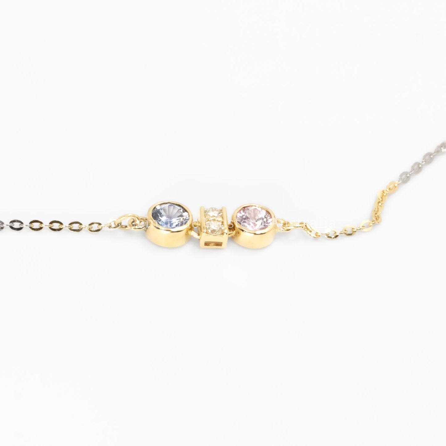 side view of Pink Sapphire & Purple Blue Sapphire Diamond Pendant in 18K Yellow Gold in neutral background