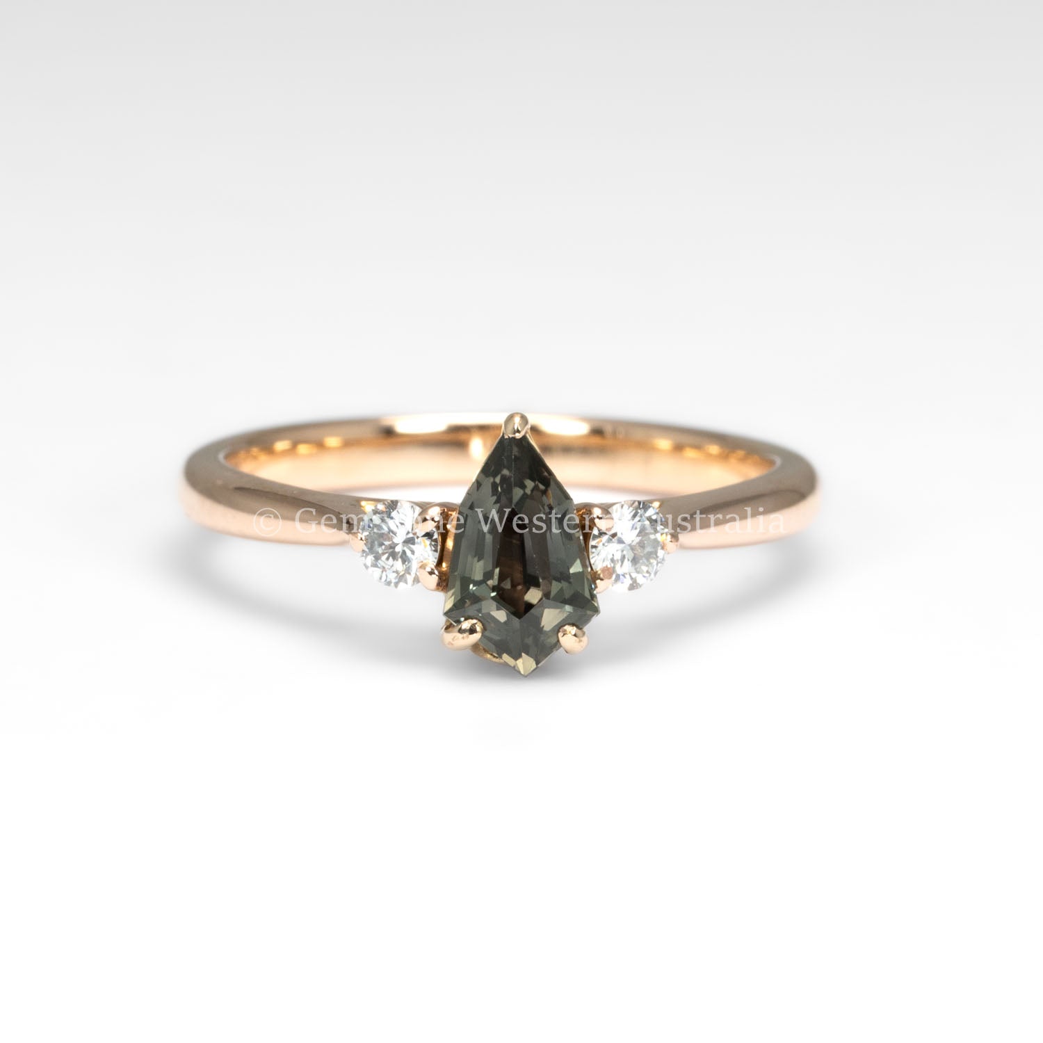 front view of Shield Cut Teal Sapphire Diamond Ring in 18K Rose Gold in white background