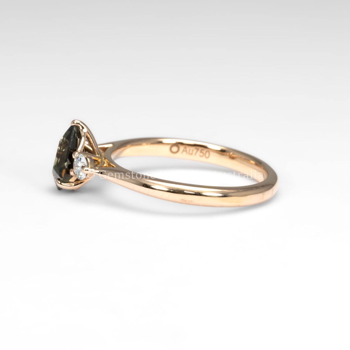 side view of Shield Cut Teal Sapphire Diamond Ring in 18K Rose Gold in white background