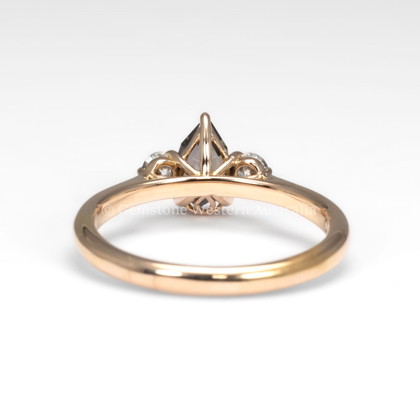 back view of Shield Cut Teal Sapphire Diamond Ring in 18K Rose Gold in white background