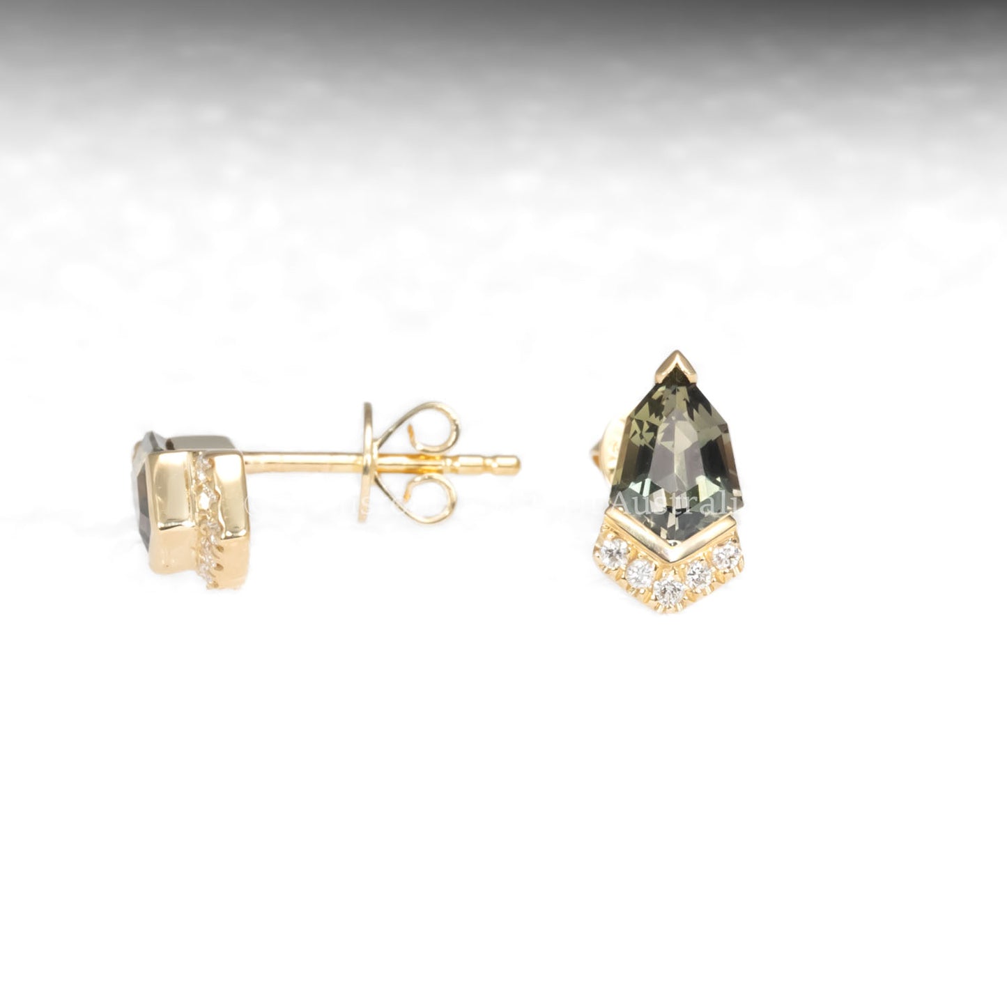 front and side view of Shield Cut Teal Sapphire Diamond Stud Earrings in 18K Yellow Gold in neutral background