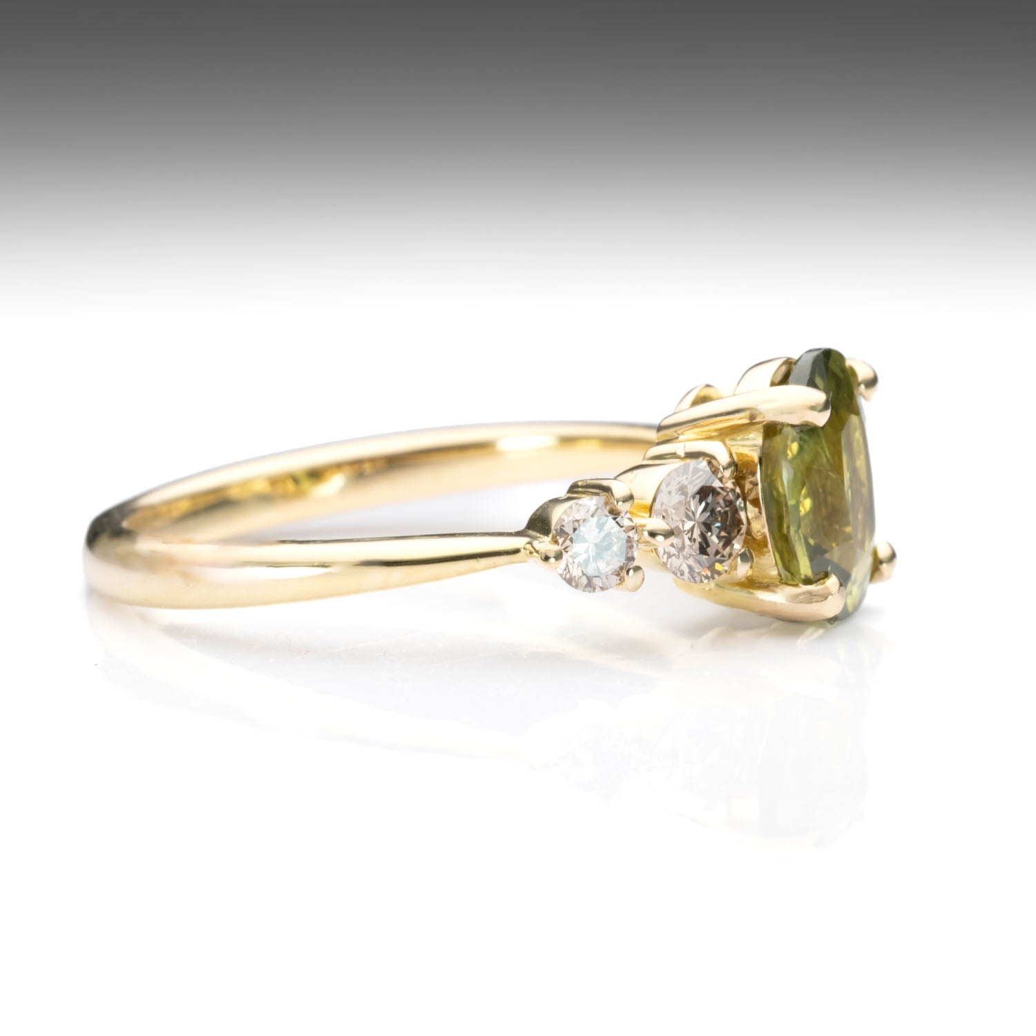 side view of Green Sapphire & Argyle Champagne Diamond Ring