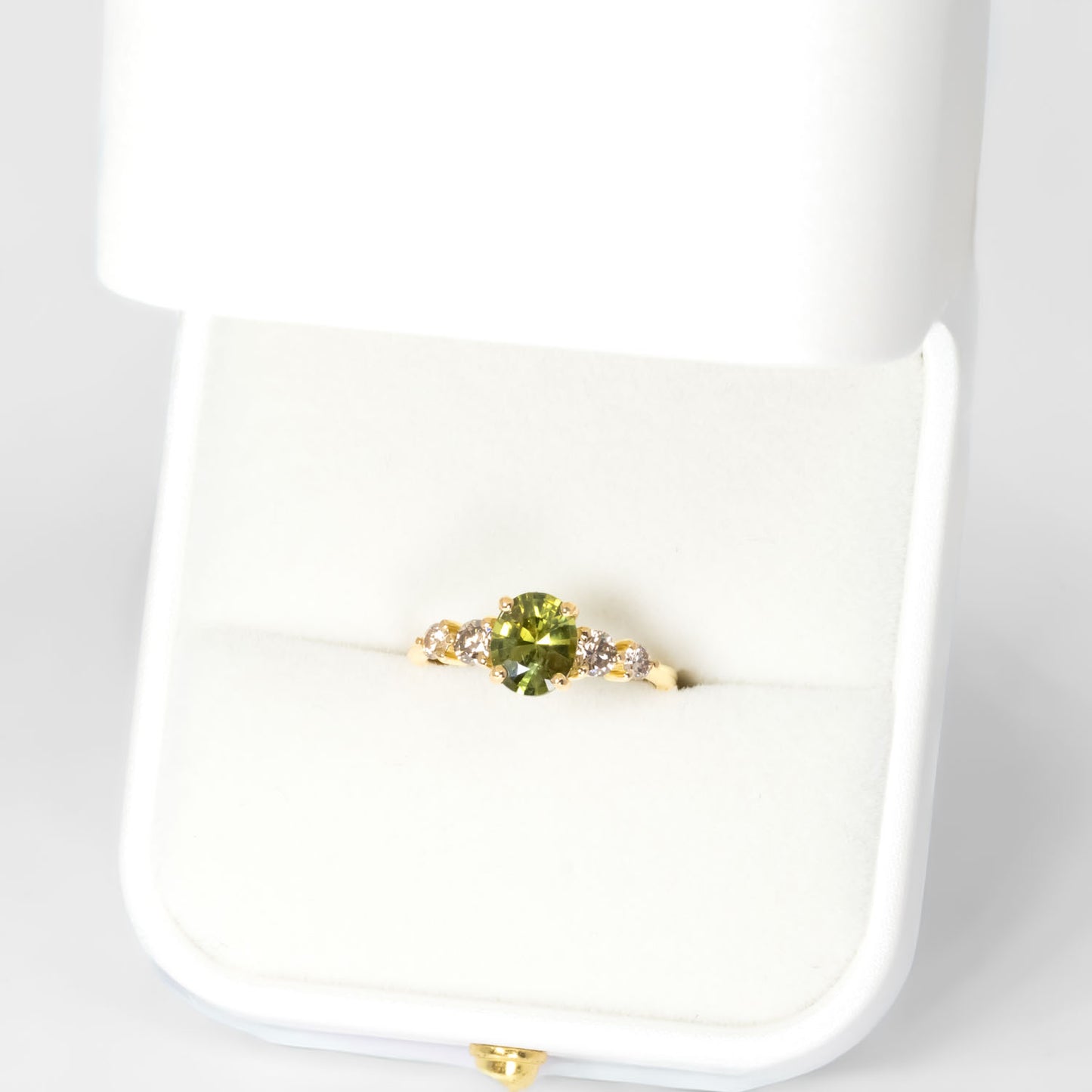 birds eye view of Green Sapphire & Argyle Champagne Diamond Ring
