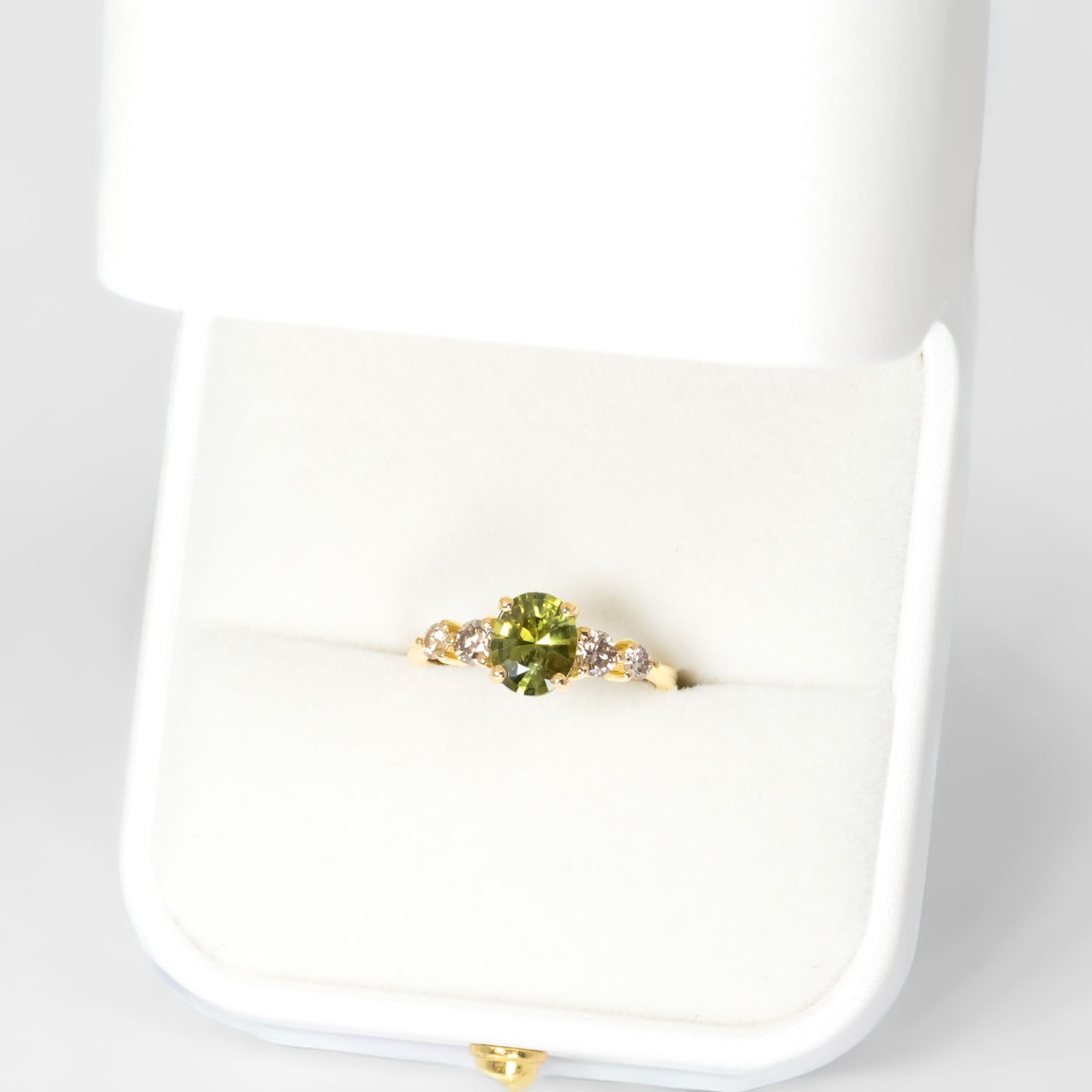 birds eye view of Green Sapphire & Argyle Champagne Diamond Ring
