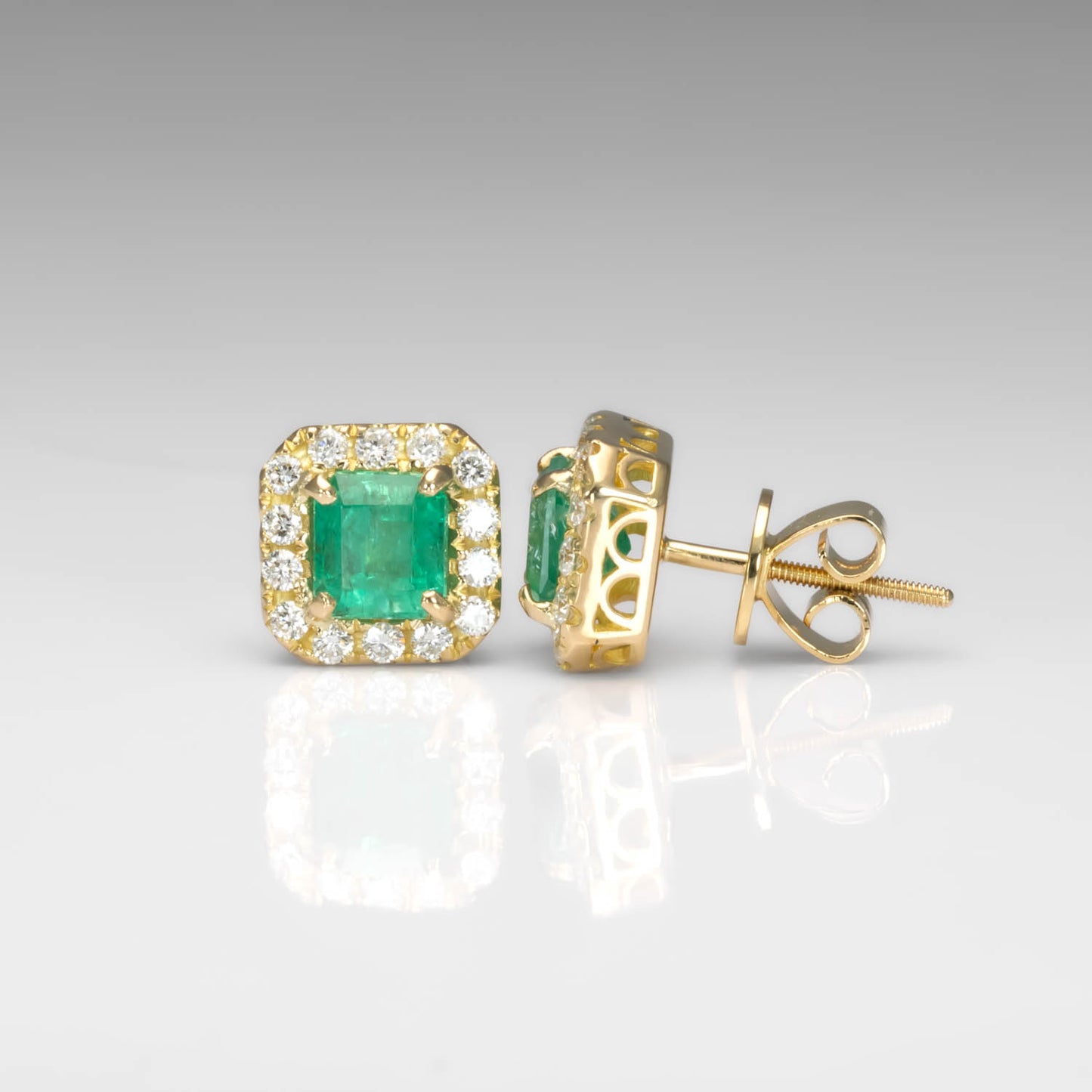 front and side view of Colombian Emerald 1.91ct & Diamond Halo Stud Earrings