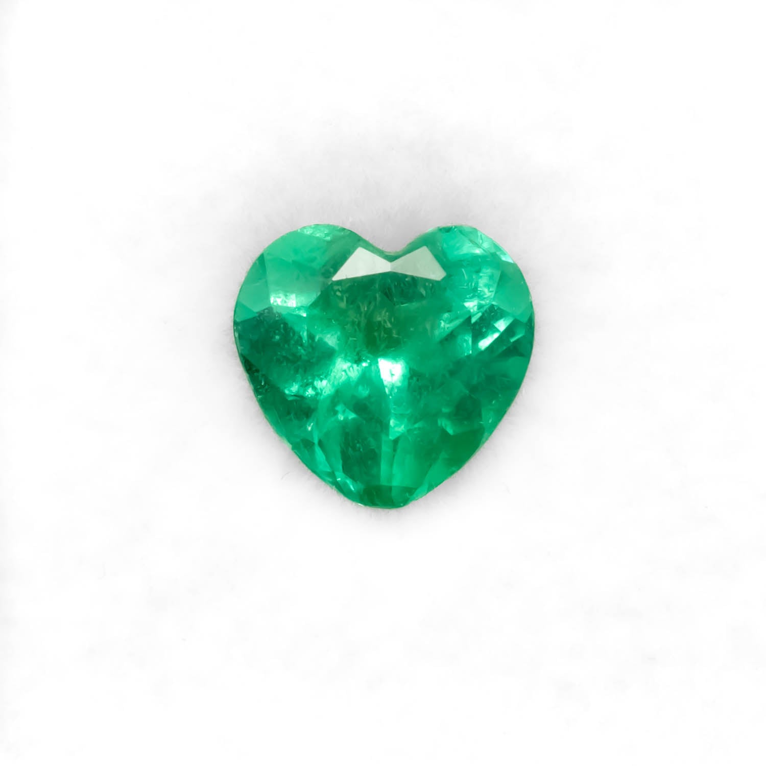 Front view of 1.48CT Natural Colombian Emerald – Heart Cut Vivid Green Gemstone in white background.
