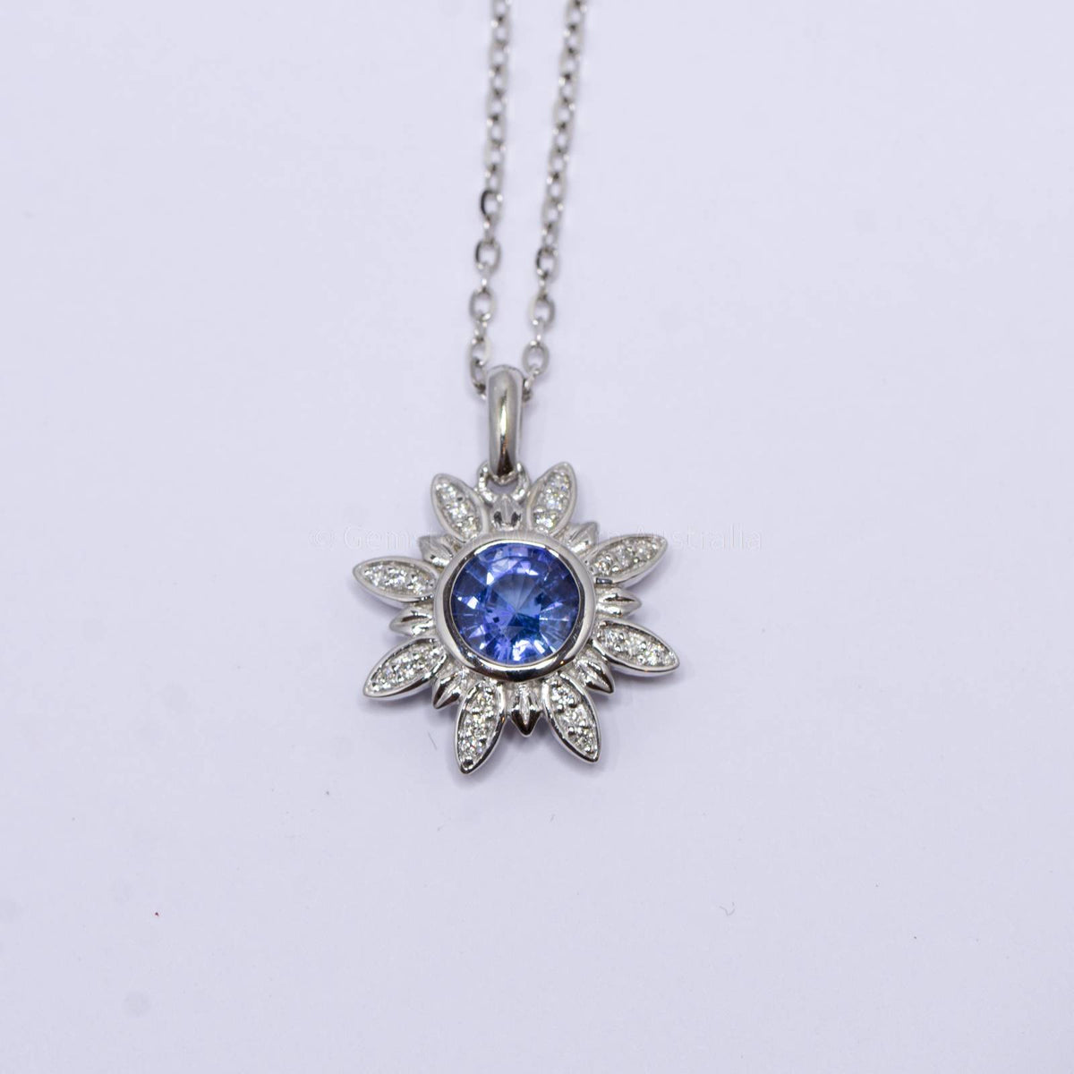 Cornflower Blue Sapphire and Diamonds Flower Pendant in 18K White Gold