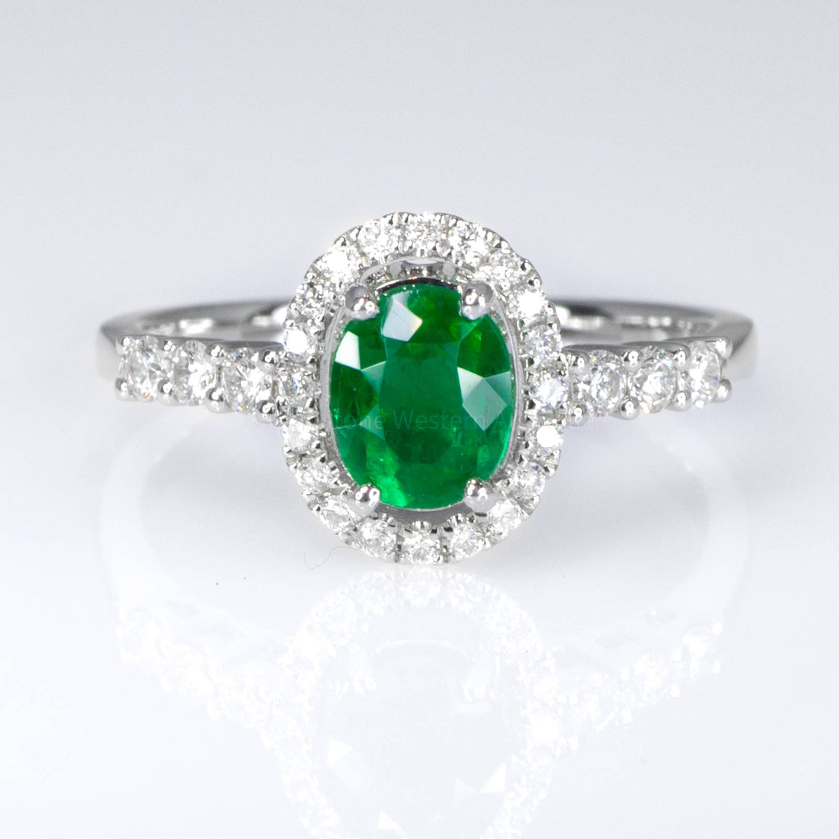 Fine Quality Colombian Emerald Halo Ring in 18K Gold