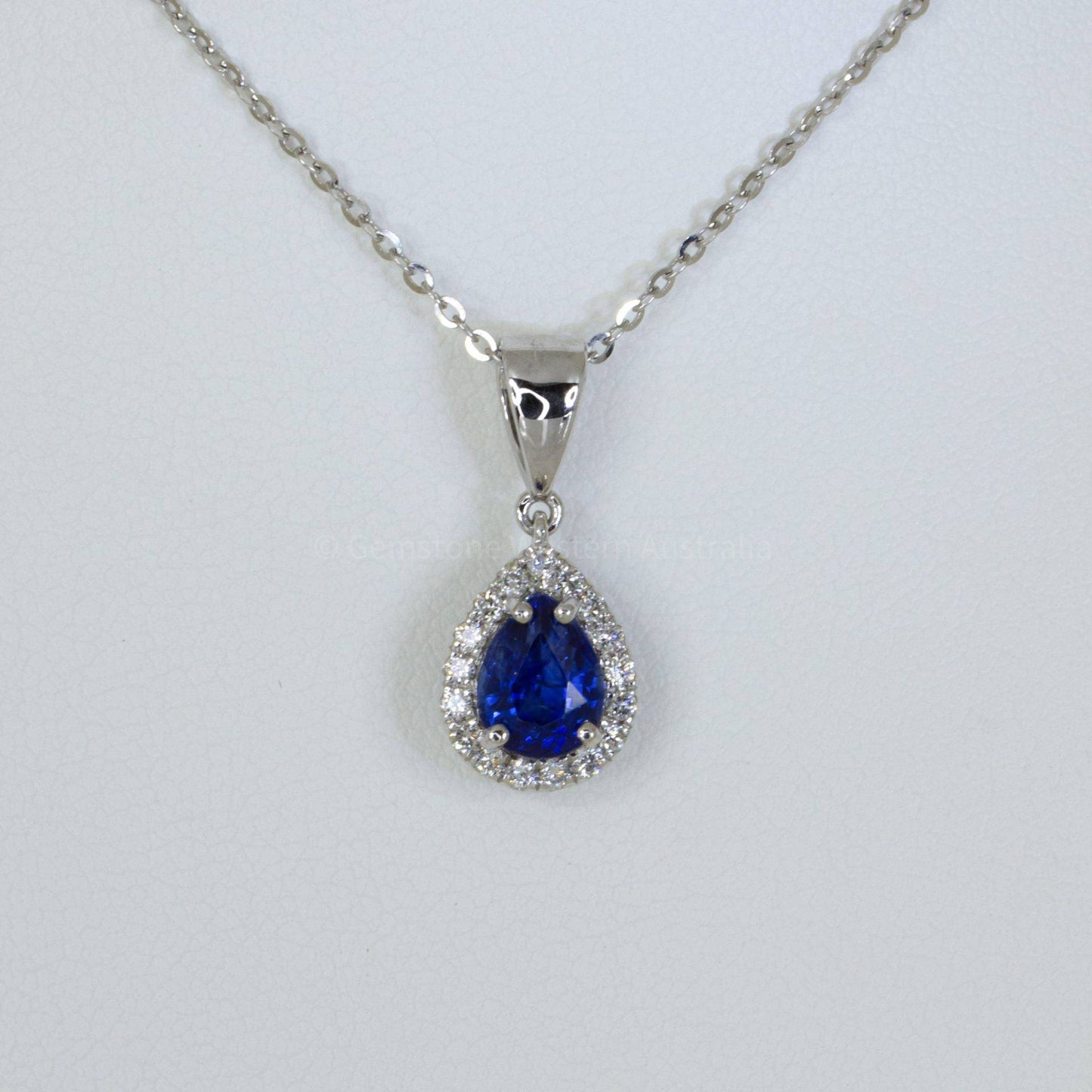 Pear Shape Blue Sapphire Halo Pendant in 18K Gold