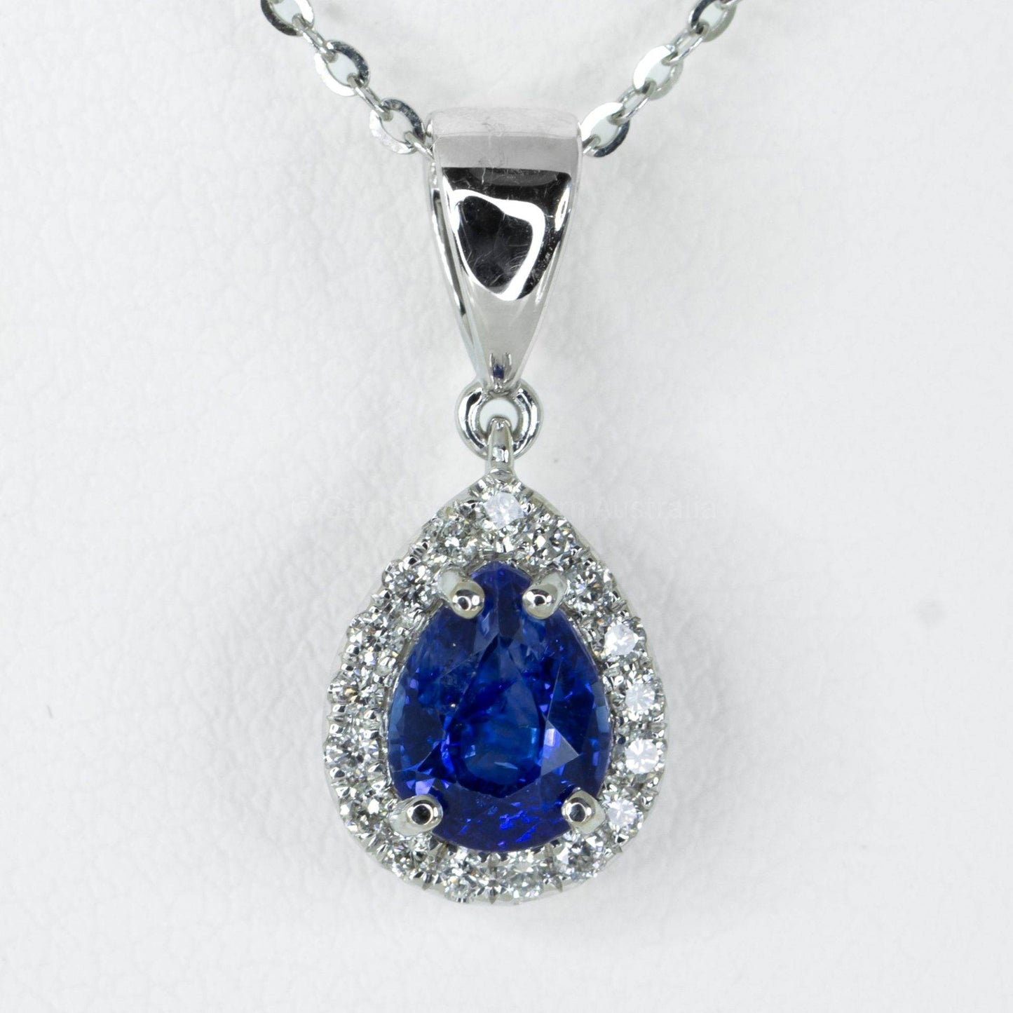Pear Shape Blue Sapphire Halo Pendant in 18K Gold