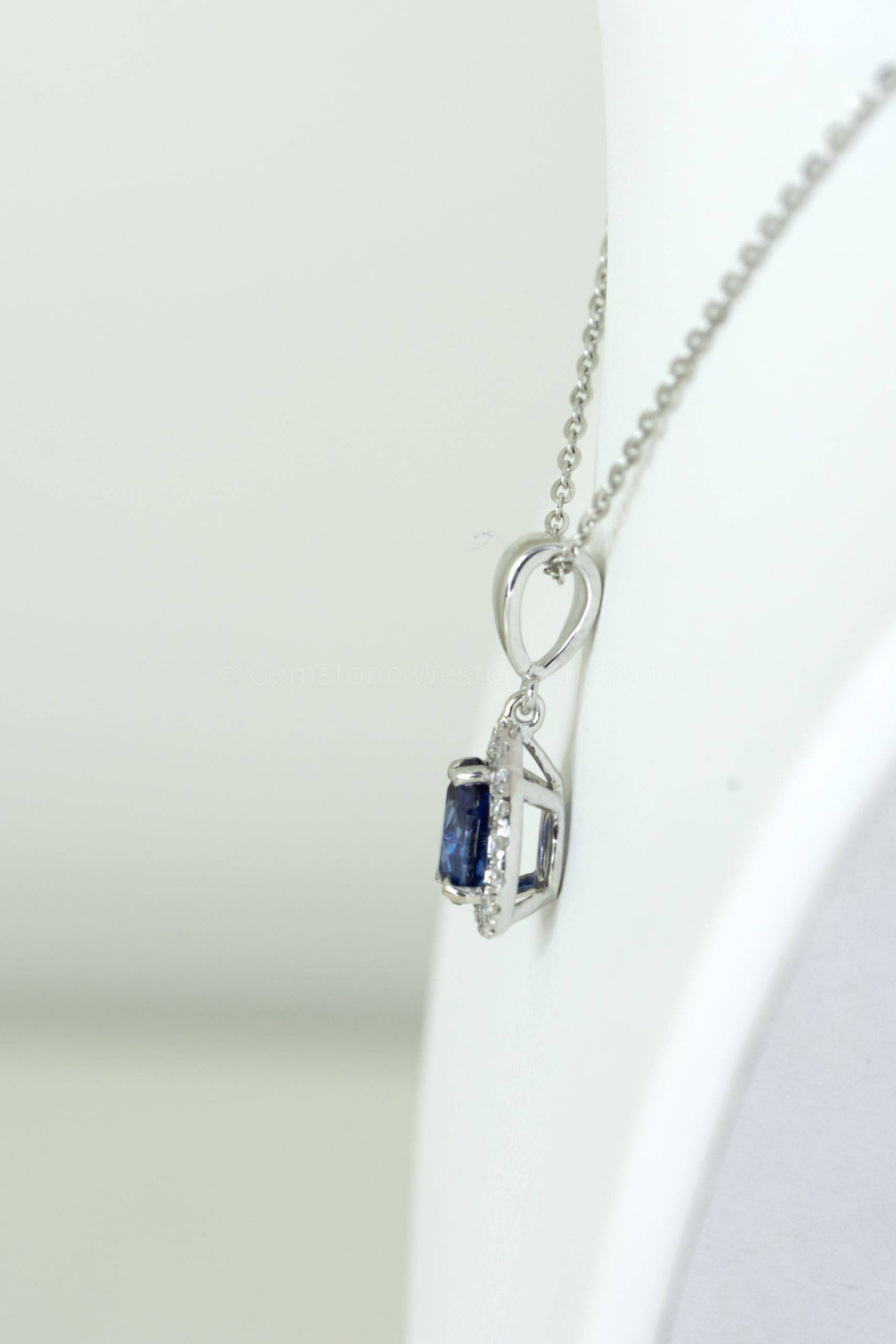 Pear Shape Blue Sapphire Halo Pendant in 18K Gold