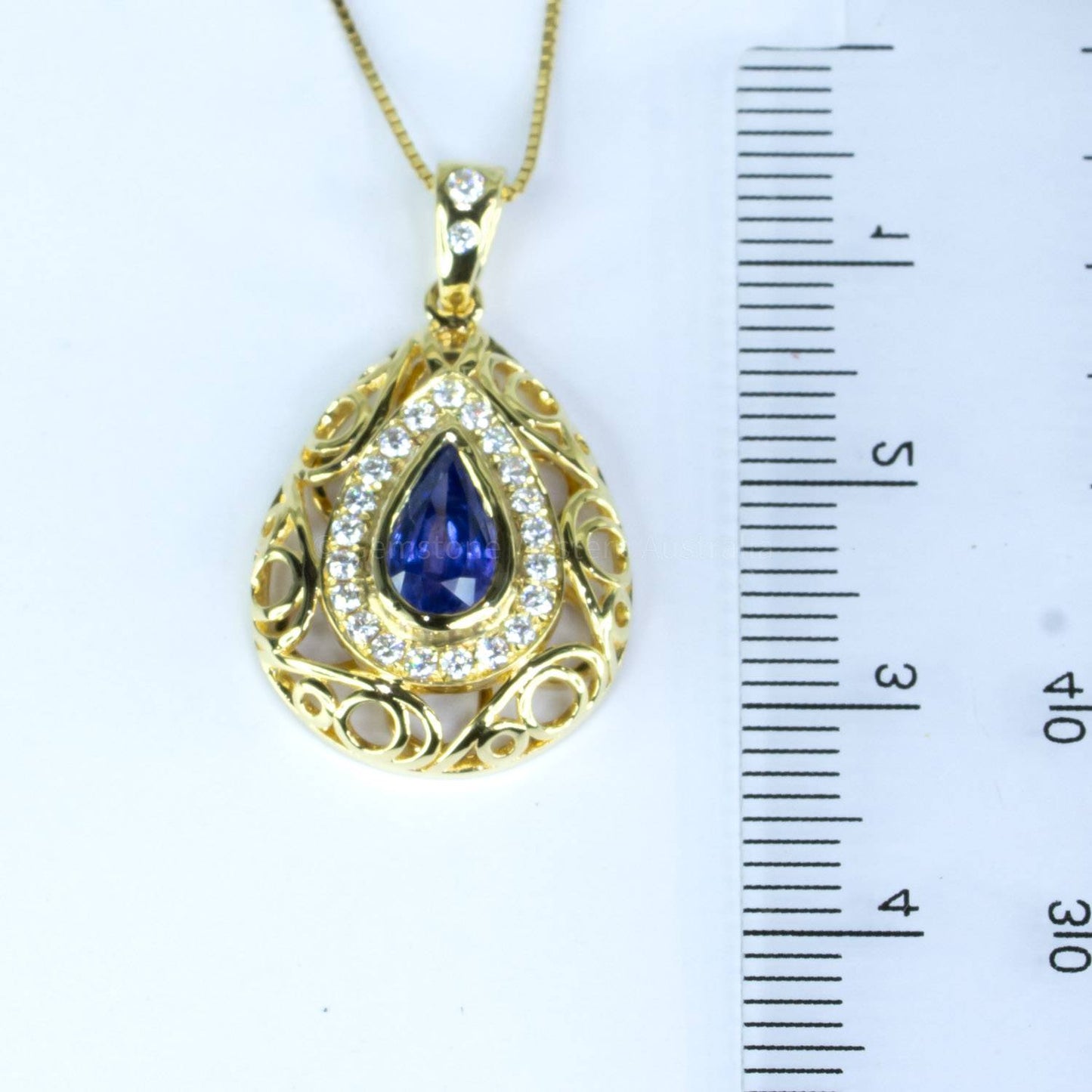 1.25ct Natural Blue Sapphire Pendant with Diamond Halo Design