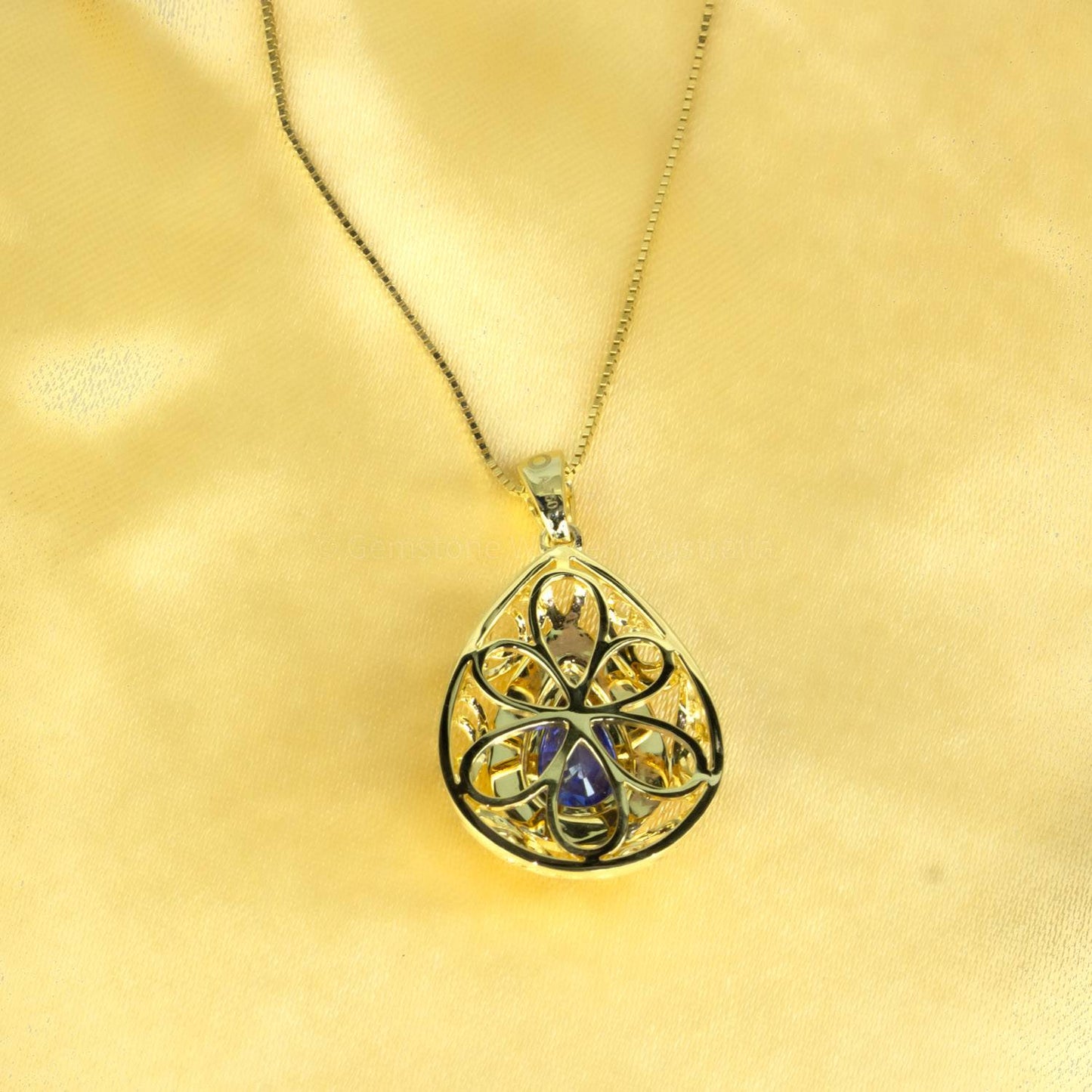 1.25ct Natural Blue Sapphire Pendant with Diamond Halo Design