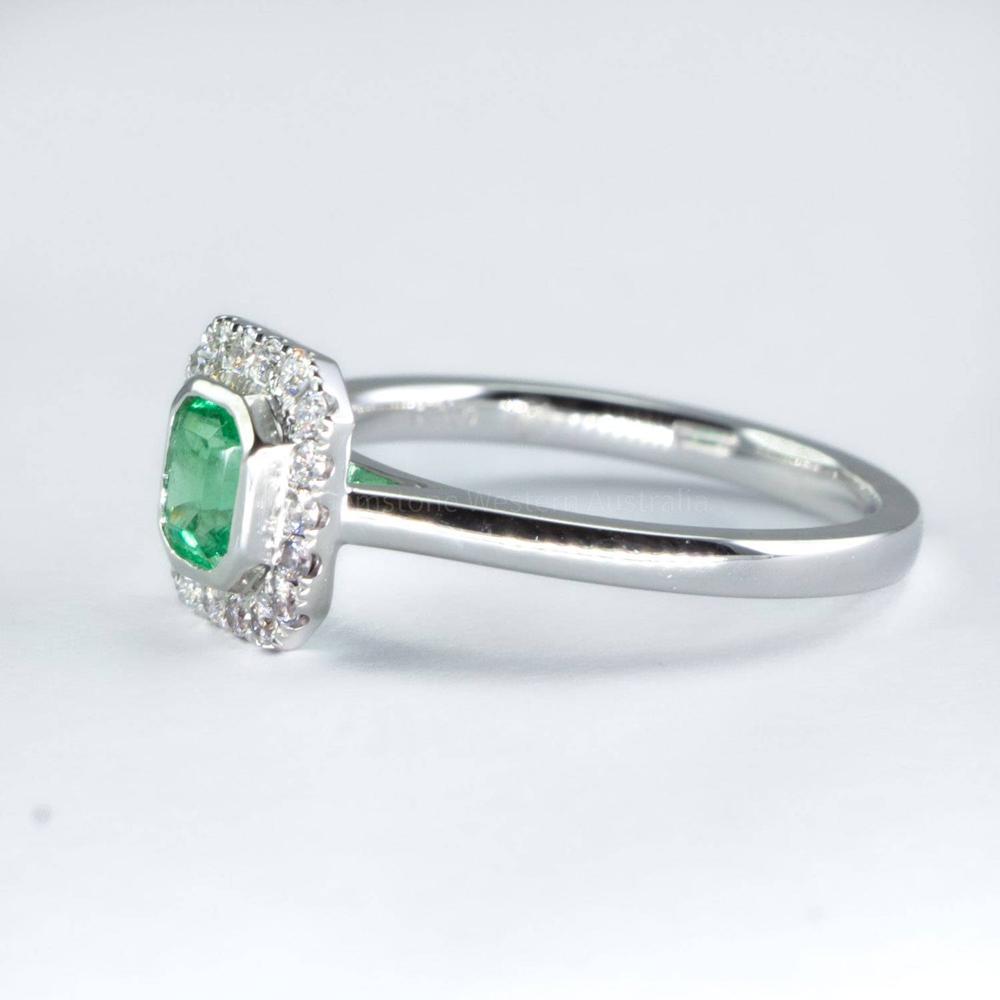 Platinum Emerald Ring with Diamond Halo
