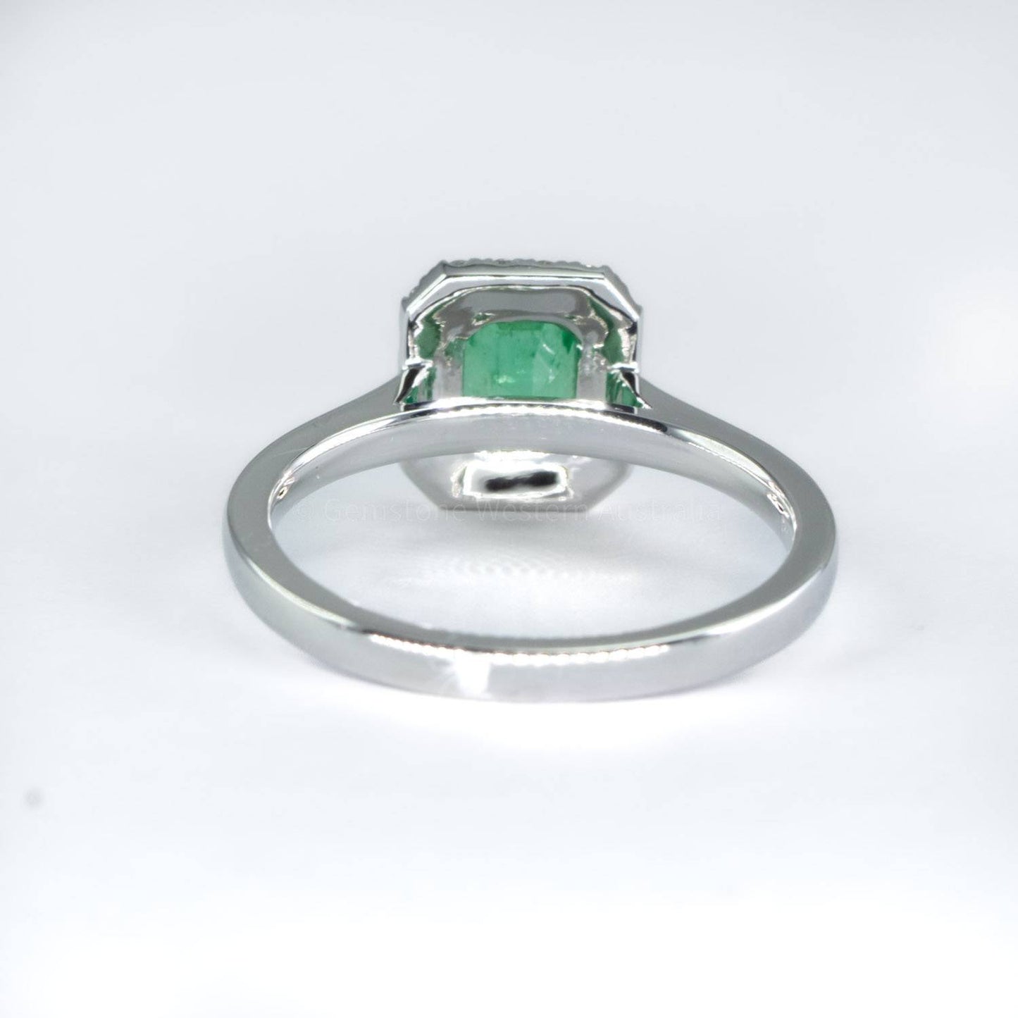 Platinum Emerald Ring with Diamond Halo