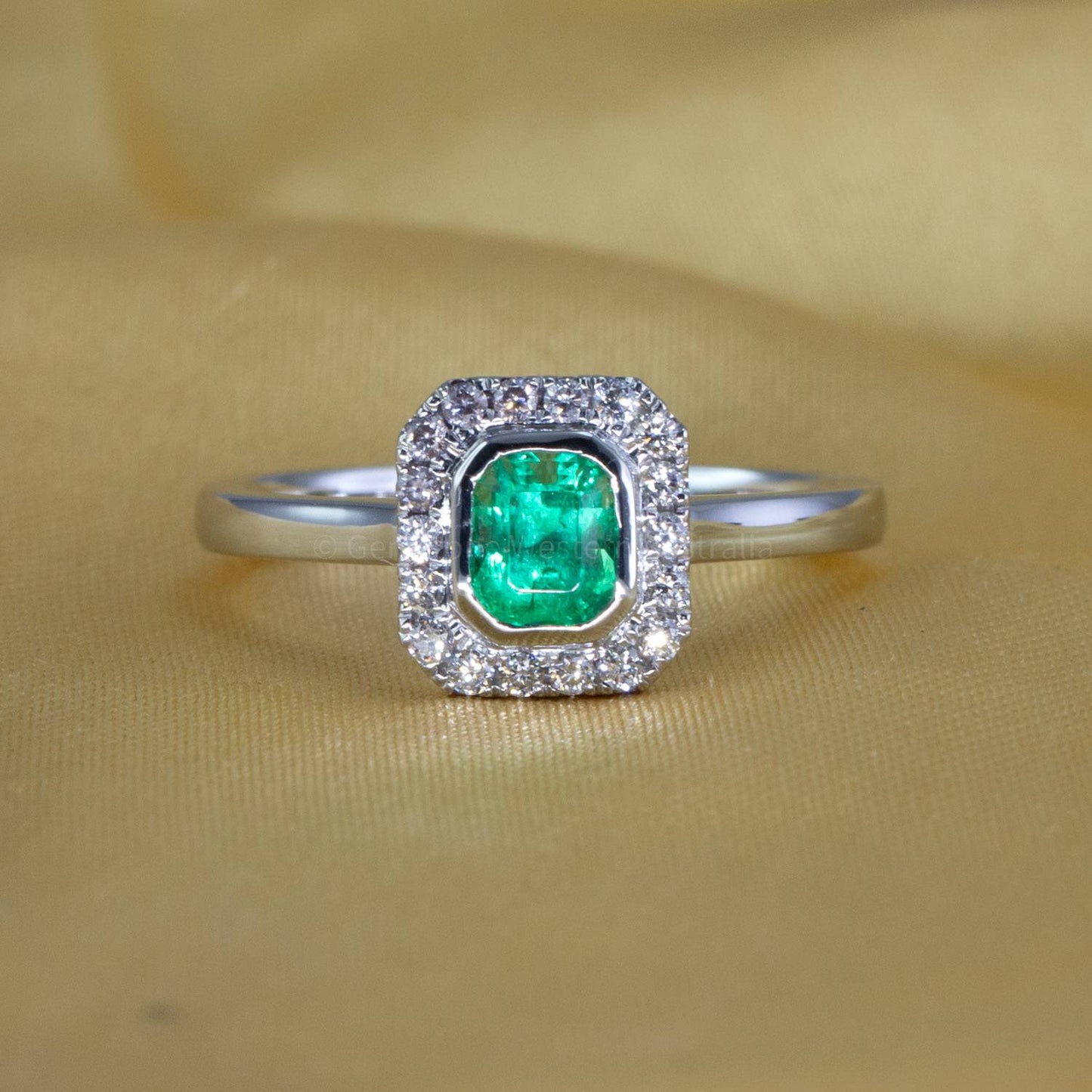 Platinum Emerald Ring with Diamond Halo
