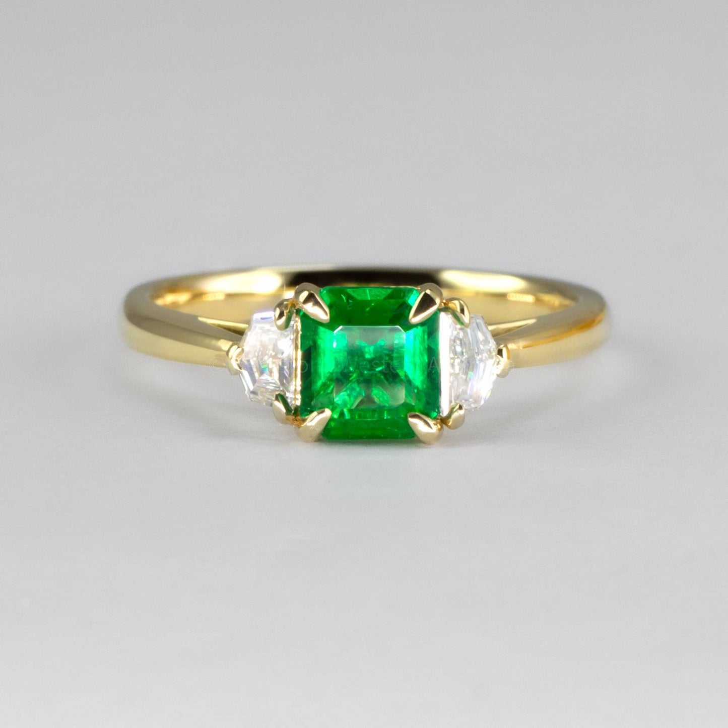 Emerald Cut Emerald and Cadillac Diamonds Three Stone Ring
